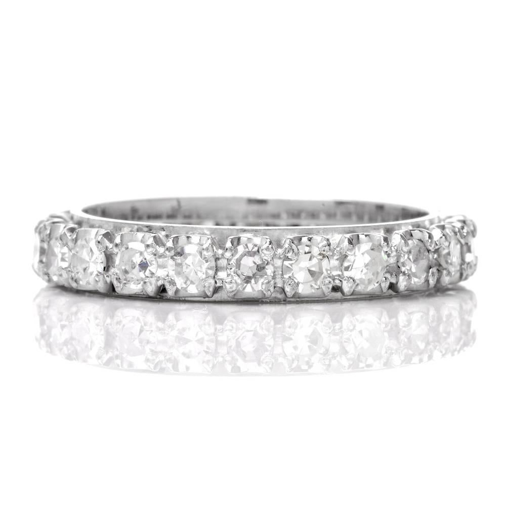 This classic Vintage Diamond eternity Band ring is crafted in solid 18K White Gold. 
It is adorned with 22 genuine round cut Diamonds all approximately 1.20 cttw, graded H-I color,  VS clarity, in a prong setting, while remaining in excellent