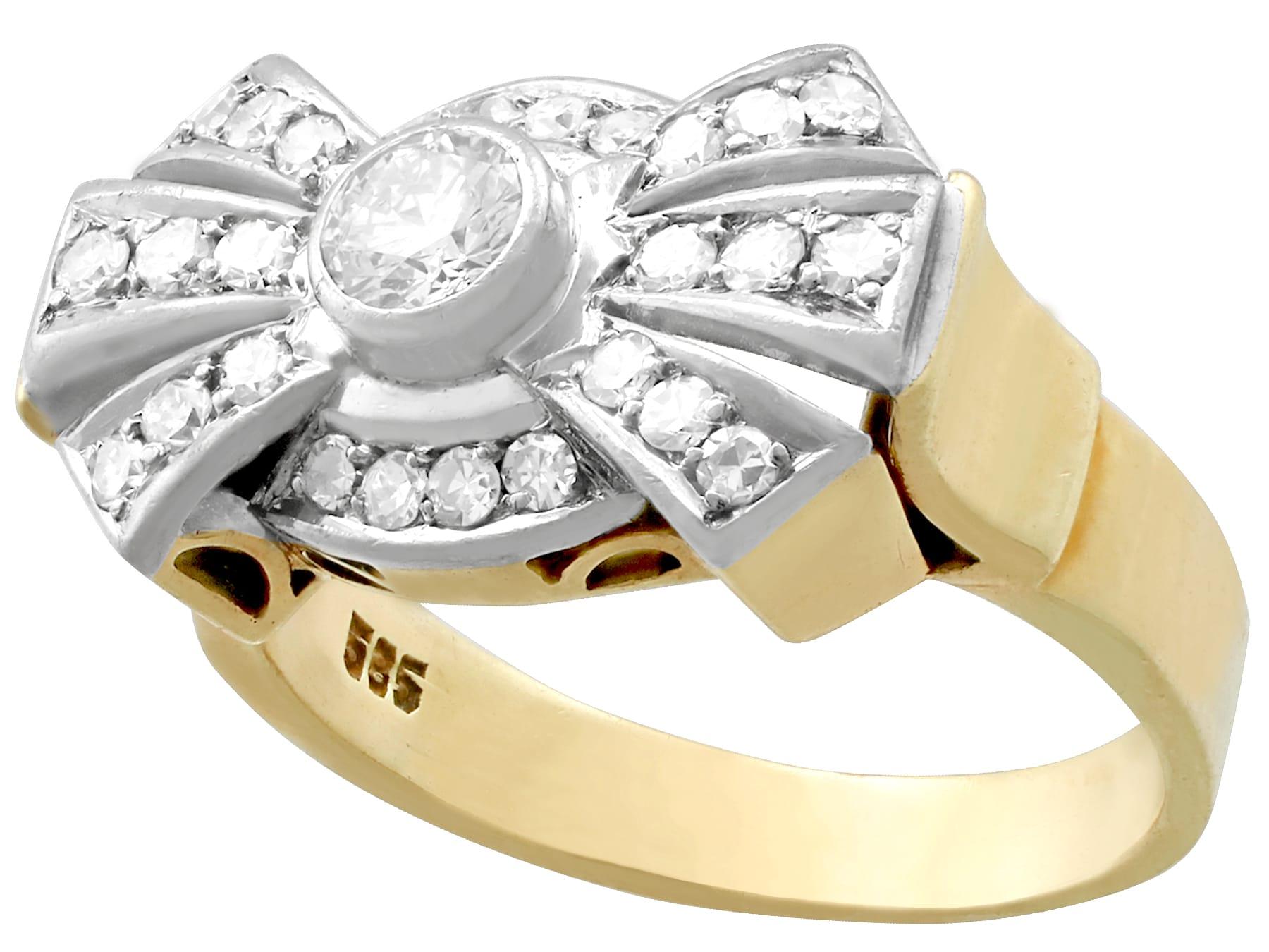 A fine and impressive vintage 0.86 carat diamond and 14 karat yellow gold, platinum set vintage cocktail/dress ring; part of our diverse diamond jewelry and estate jewelry collections.

This fine and impressive vintage diamond cocktail ring has been
