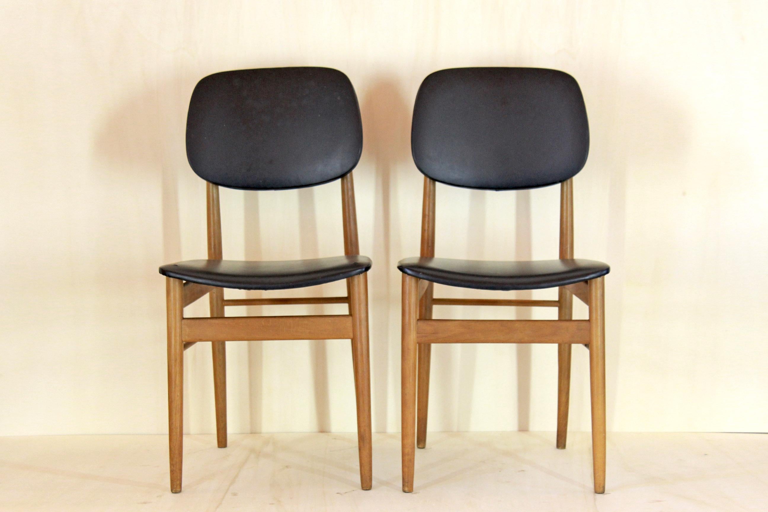 Two dining chairs designed by 