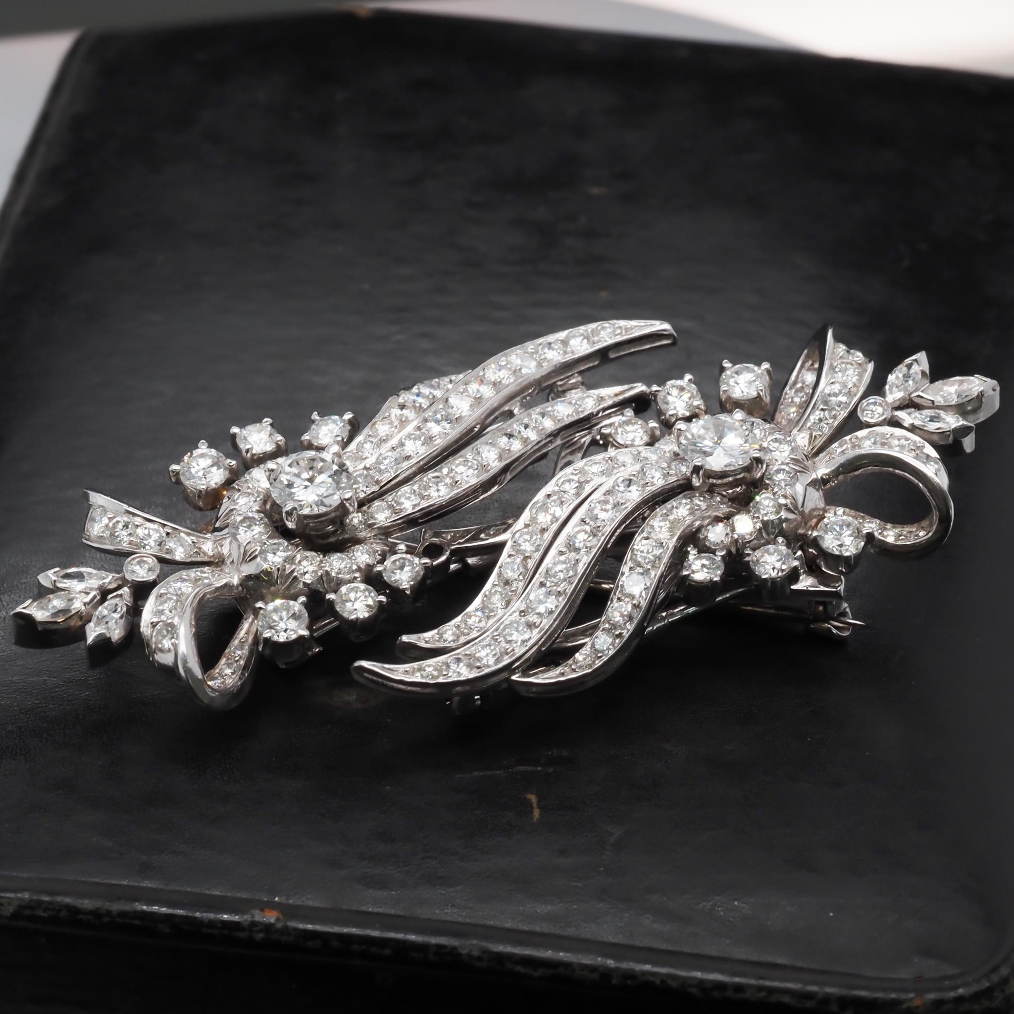 Metal Type: Platinum (Pin is 14K White Gold) [Hallmarked, and Tested]
Weight: 27.3 grams
*Clips detach to be worn separately or you can wear as 1 large brooch.
Center Diamond Details:
Weight: 1.20ct (2 Diamonds, .60ct each)
Cut: Round