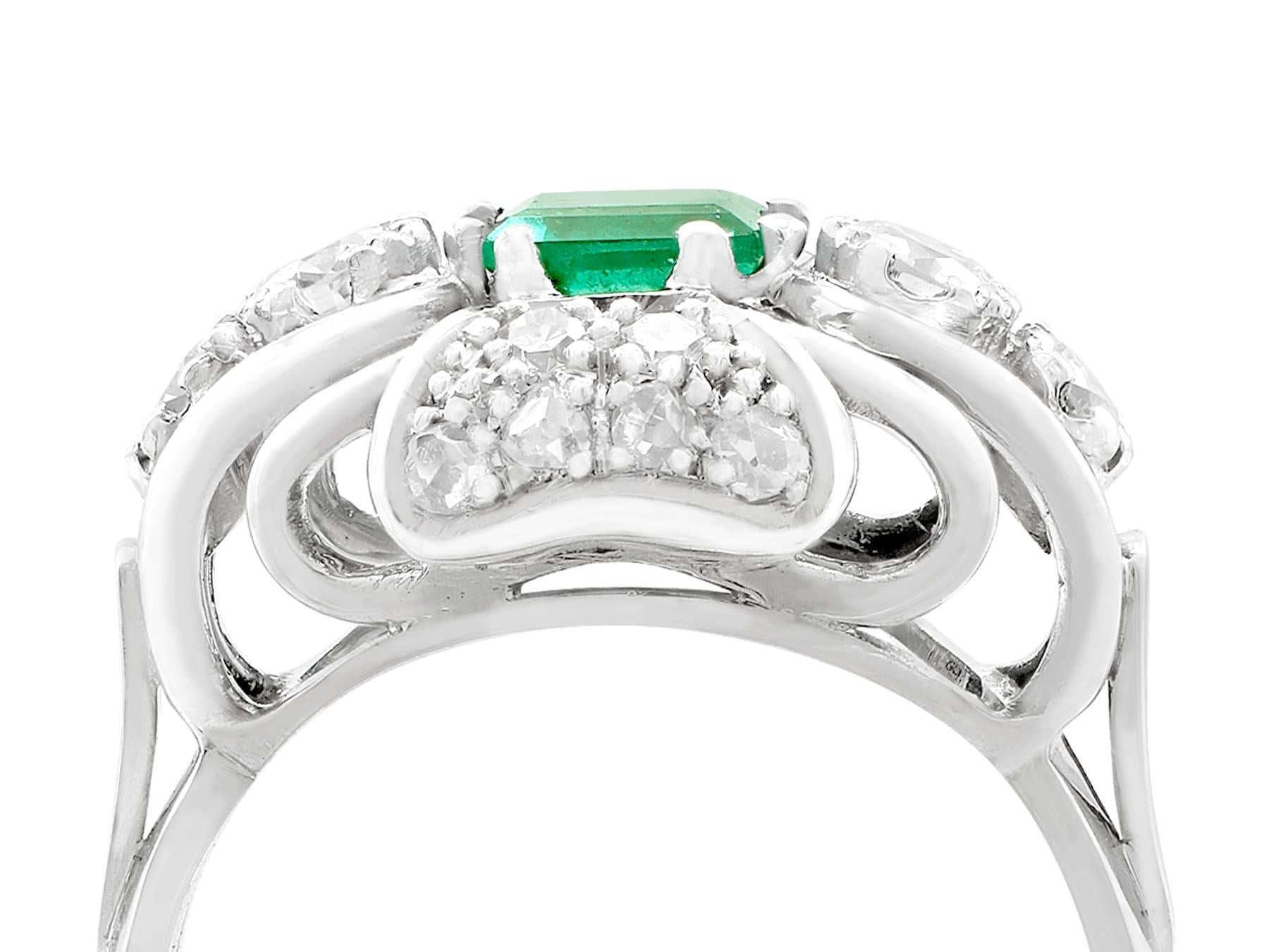 An impressive vintage 1950s 0.55 carat emerald and 0.46 carat diamond, 14 karat white gold dress ring; part of our diverse vintage jewelry and estate jewelry collections.

This fine and impressive vintage emerald and diamond ring has been crafted in