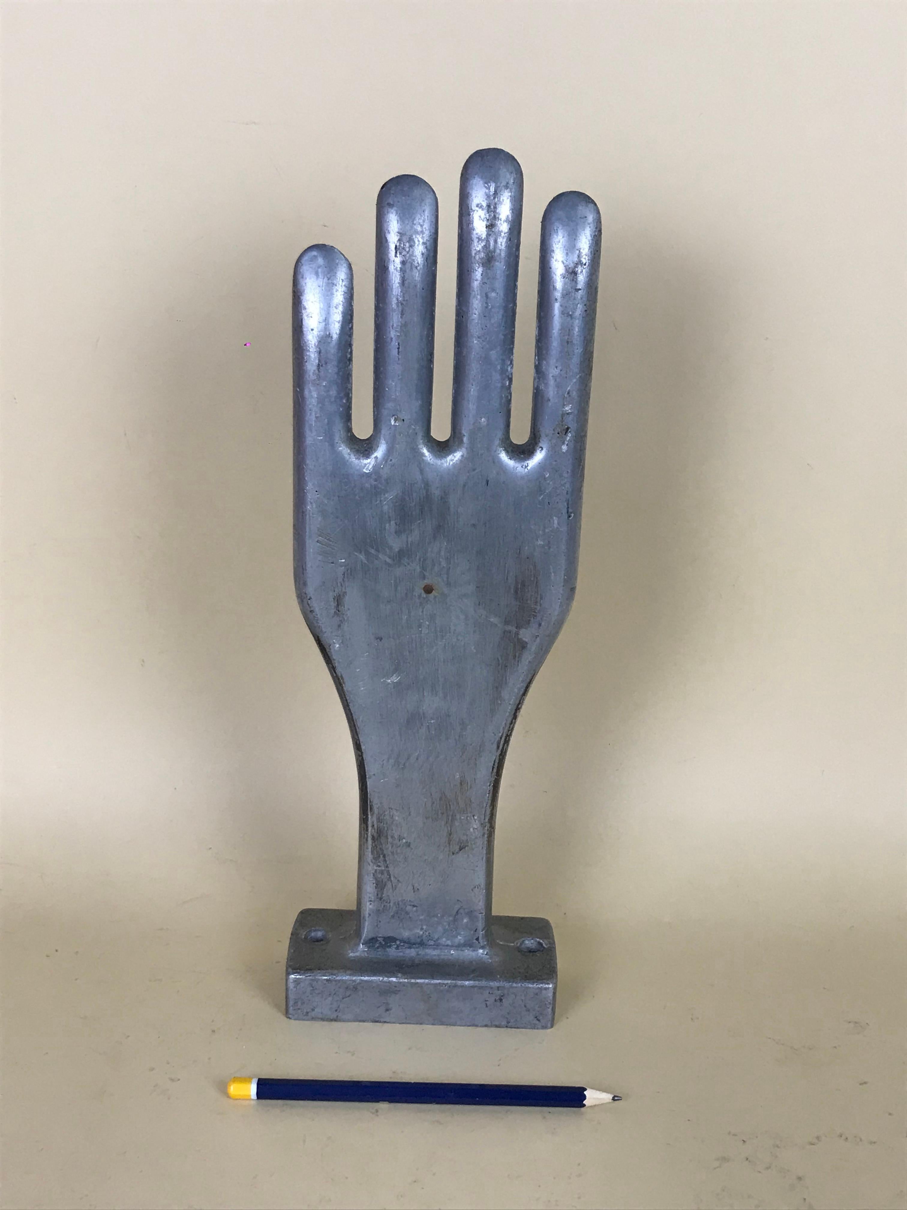1950s vintage French freestanding aluminium industrial rubber glove size large mold.



 