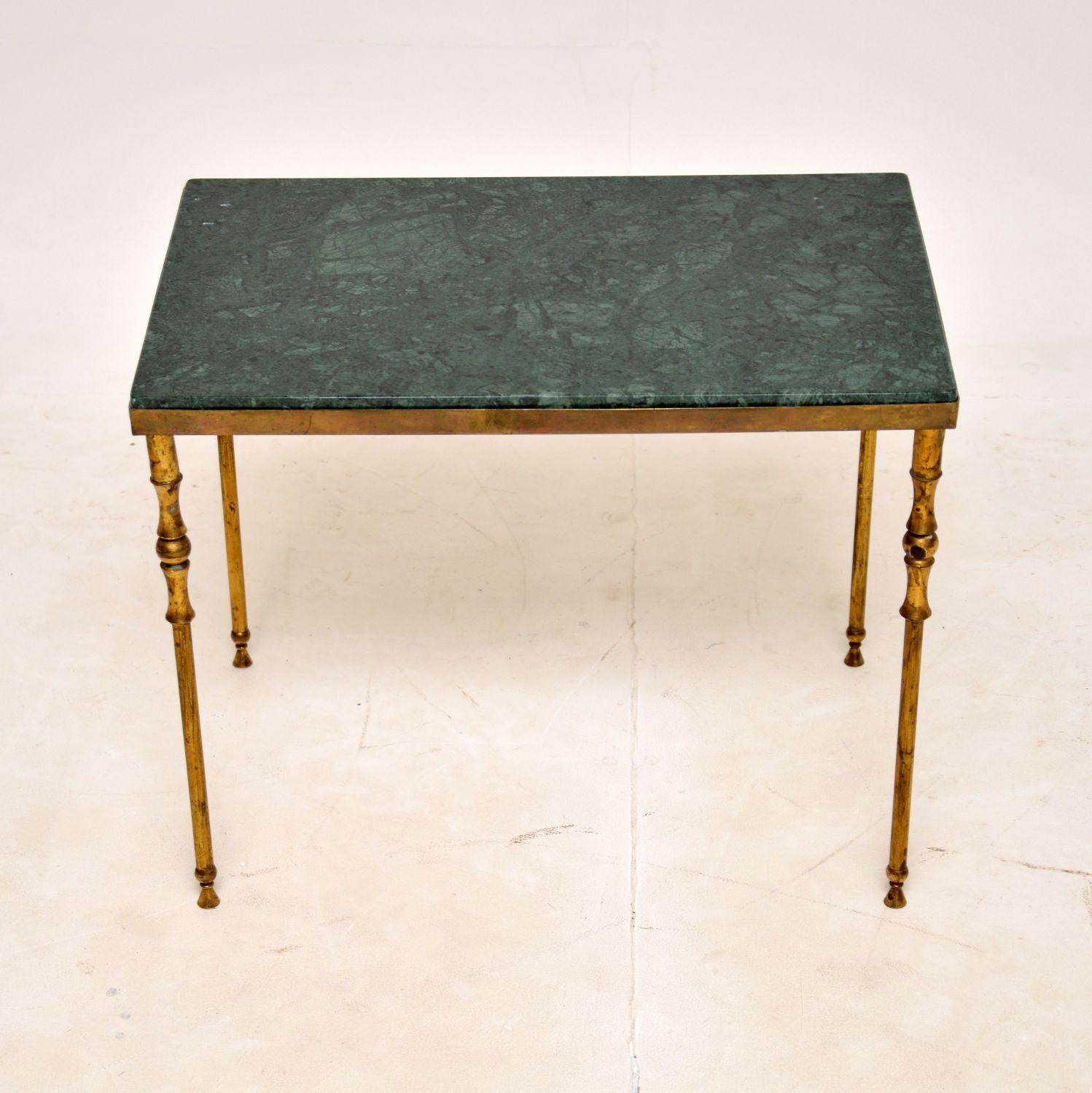 A very stylish and well made vintage side table in solid brass and marble. This was made in France, it dates from the 1950-60’s.

The frame has an elegant yet very strong design, the legs are beautifully turned. We have had the inset green marble