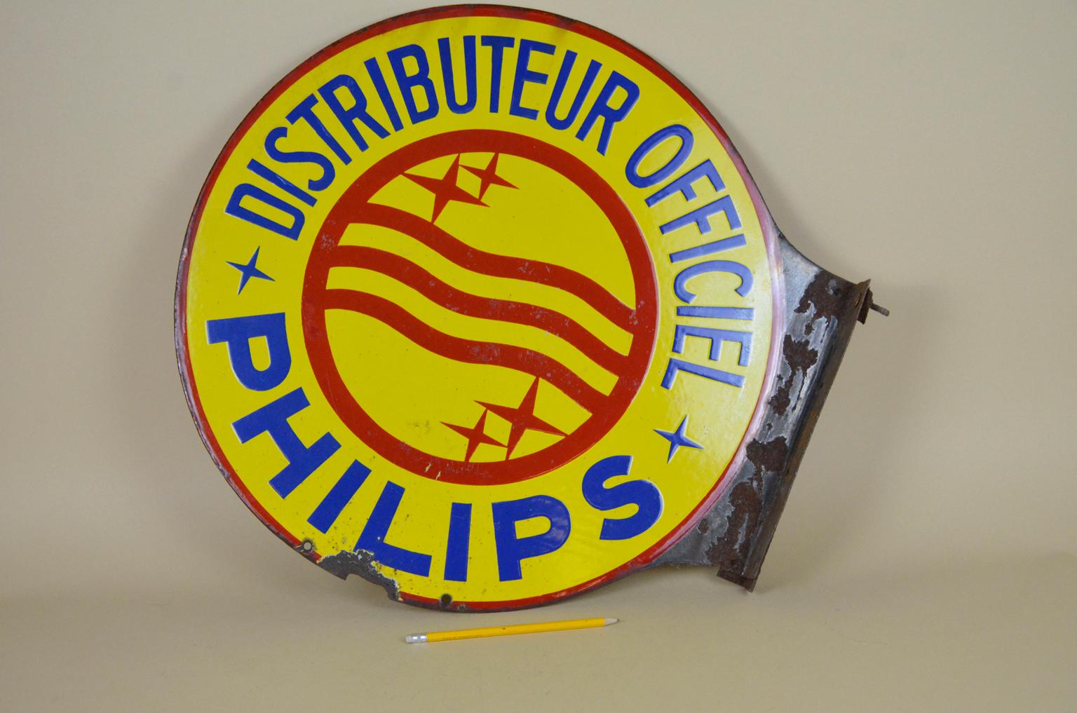 Vintage round double sided advertising Philips enamel metal sign in yellow and red.
Produced by Émaillerie Alsacienne Strasbourg Oenheim in the 1950s.

The sign was used in France by the official resellers (distributeur officiel) of Dutch