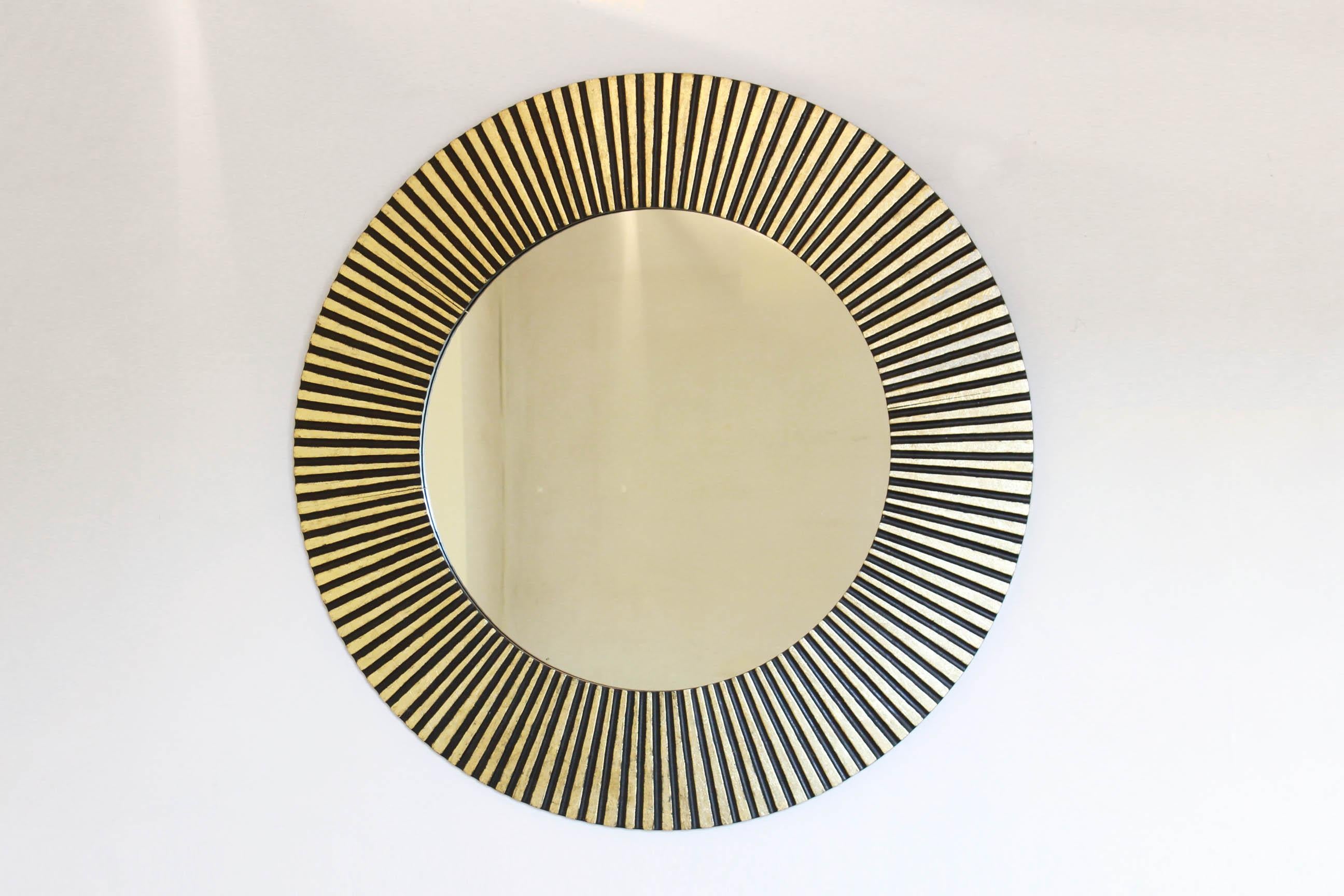 A rare made in Italy sunburst gold leaf round mirror made by inlaid solid wood. Perfect round shape, the item is in very good conditions with only small signs of time. Original glass.

NOTE: contact us for info and requests.  If possibile, we could