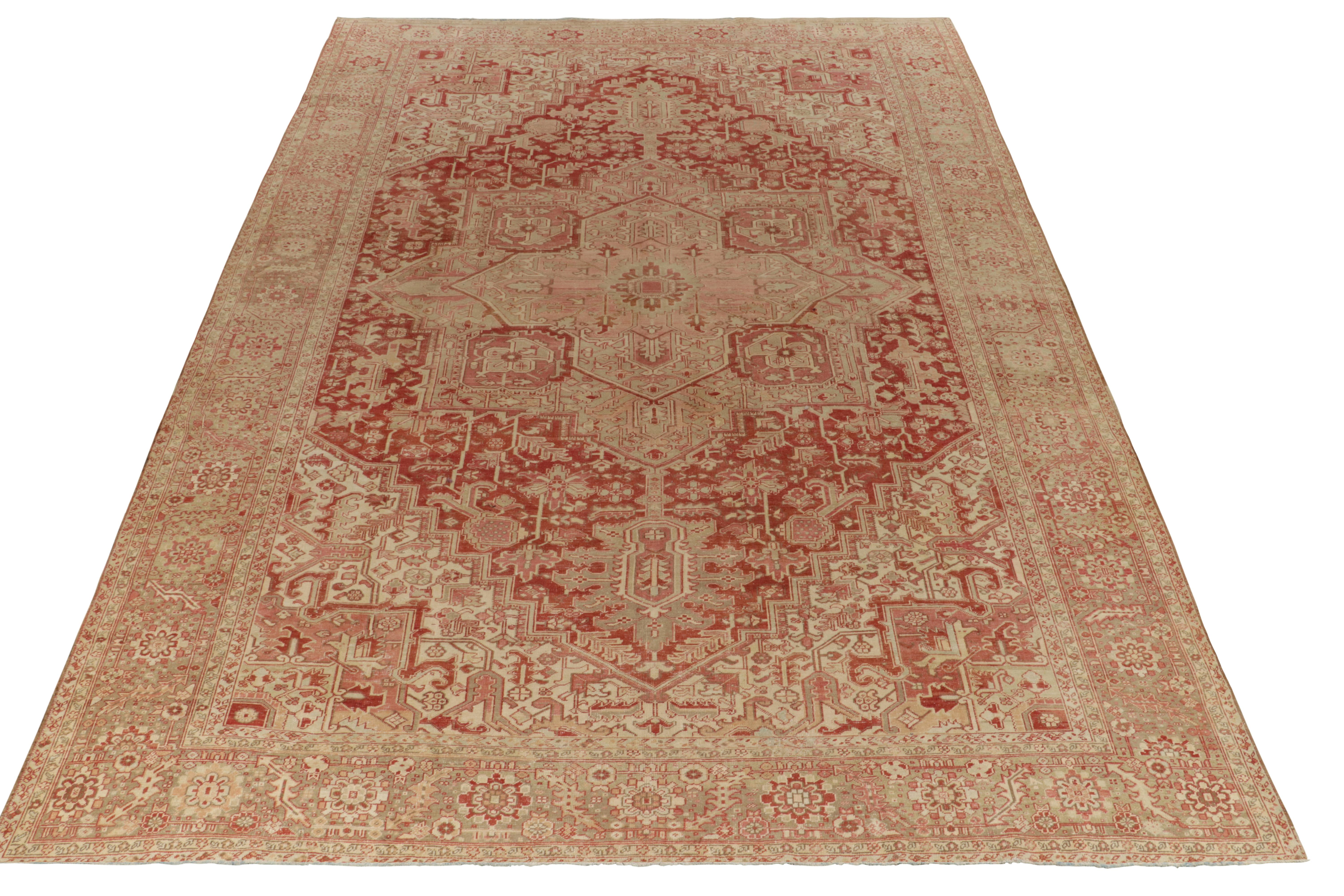 From Rug & Kilim’s Antique & Vintage collection, an alluring 11x16 Heriz Serapi rug originating from Persia circa 1950-1960. Exemplifying the rosette medallions this lineage enjoys, the rug witnesses a departure in colors with red background