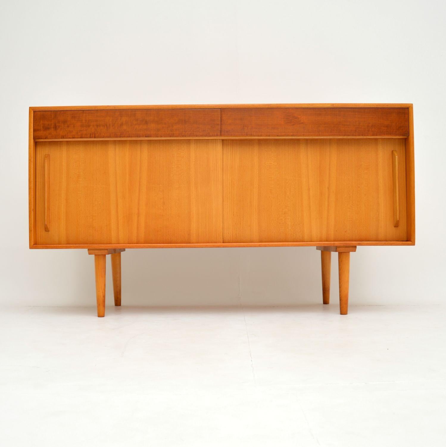 A stylish and iconic design, this is the Hilleplan sideboard, designed by Robin Day in 1952. This example dates from the year 1952, it must have been among one of the very first made. It has an early Hille badge in the top drawer, and there is a