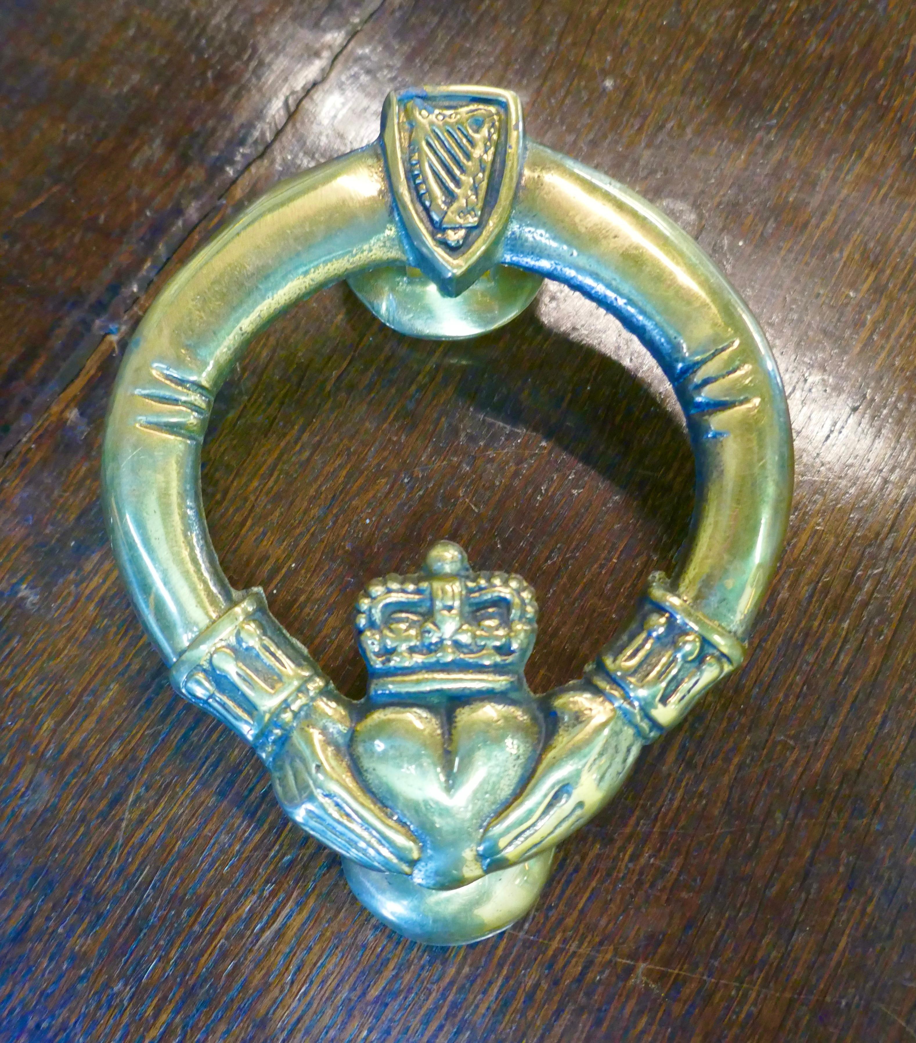 1950s vintage Irish Celtic Claddah brass door knocker.

A Traditional Celtic design with a centre heart and an Irish harp at the top
The Claddah symbol originated in Ireland the knocker is in good condition, it comes with new threaded fixings and