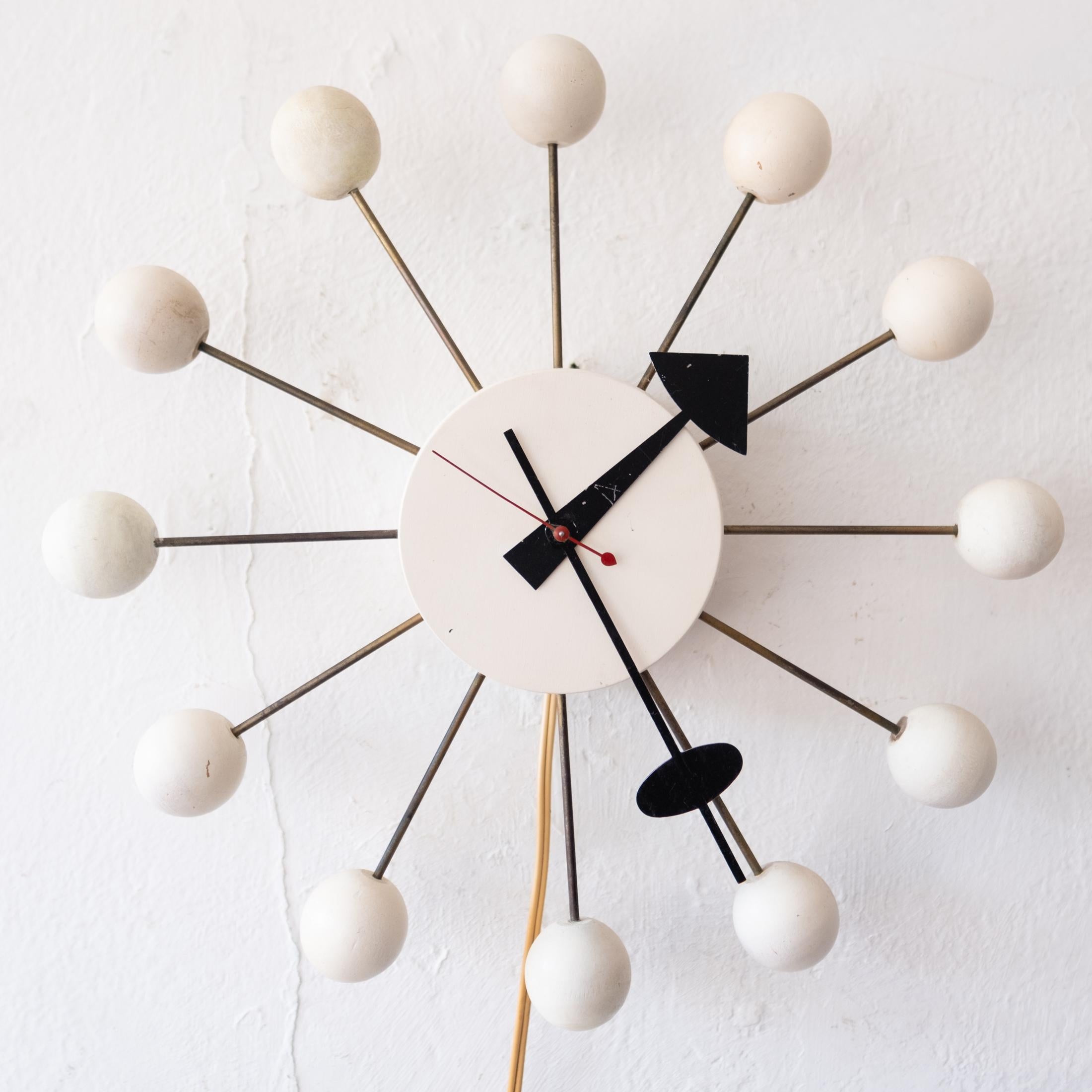 Vintage Isamu Noguchi and George Nelson Ball Clock. Produced by Howard Miller, with original tag. Designed in 1946.  Runs well and retains the original hands, including the second hand (which is often missing).  

From George Nelson: The Design of