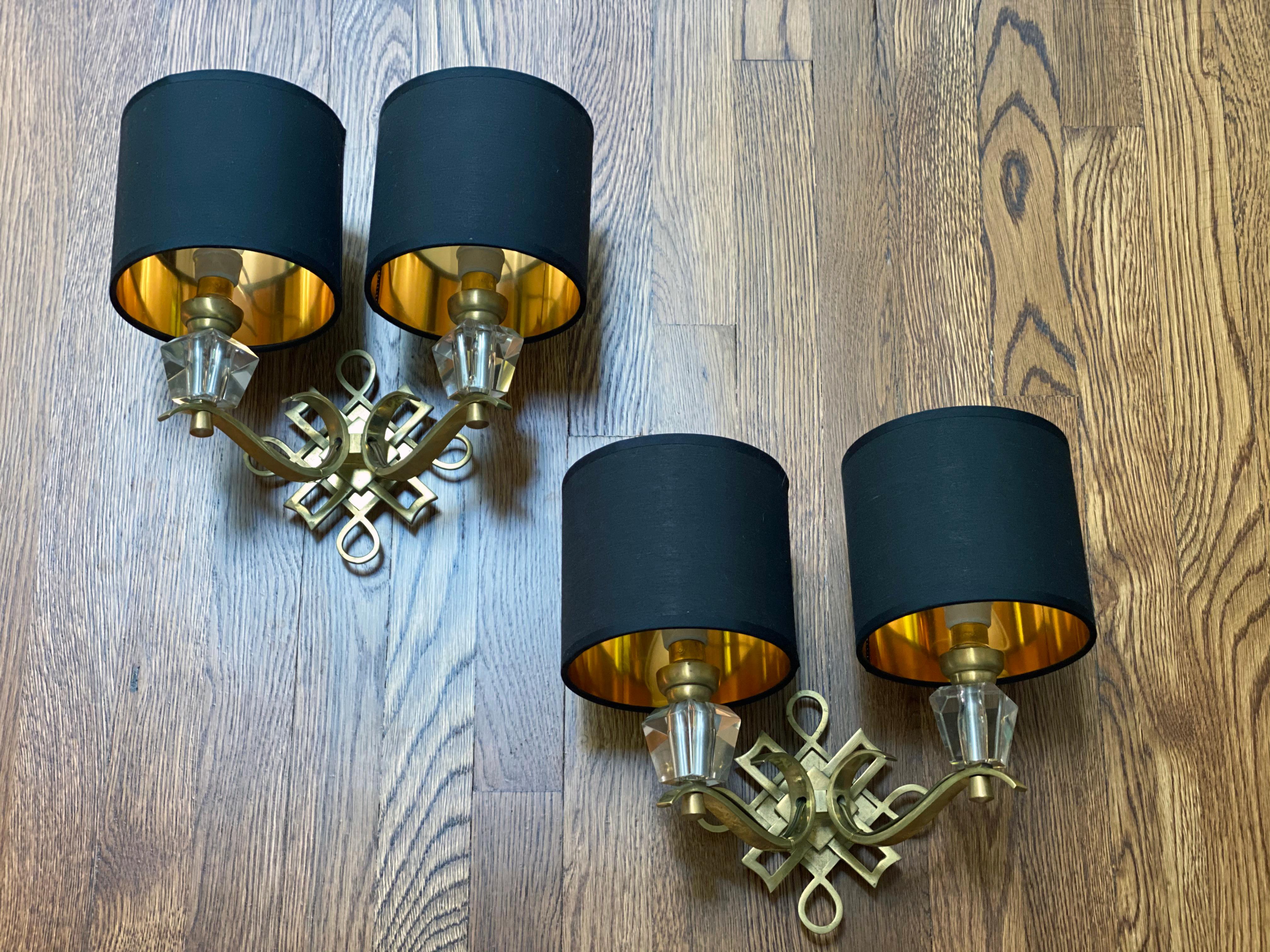 Jules Leleu polished brass and glass pair of sconces, attributed to Jules Leleu. Three pairs available. Professionally rewired. Original porcelain socket. Total of 6 sconces available. Sold as a set of six.