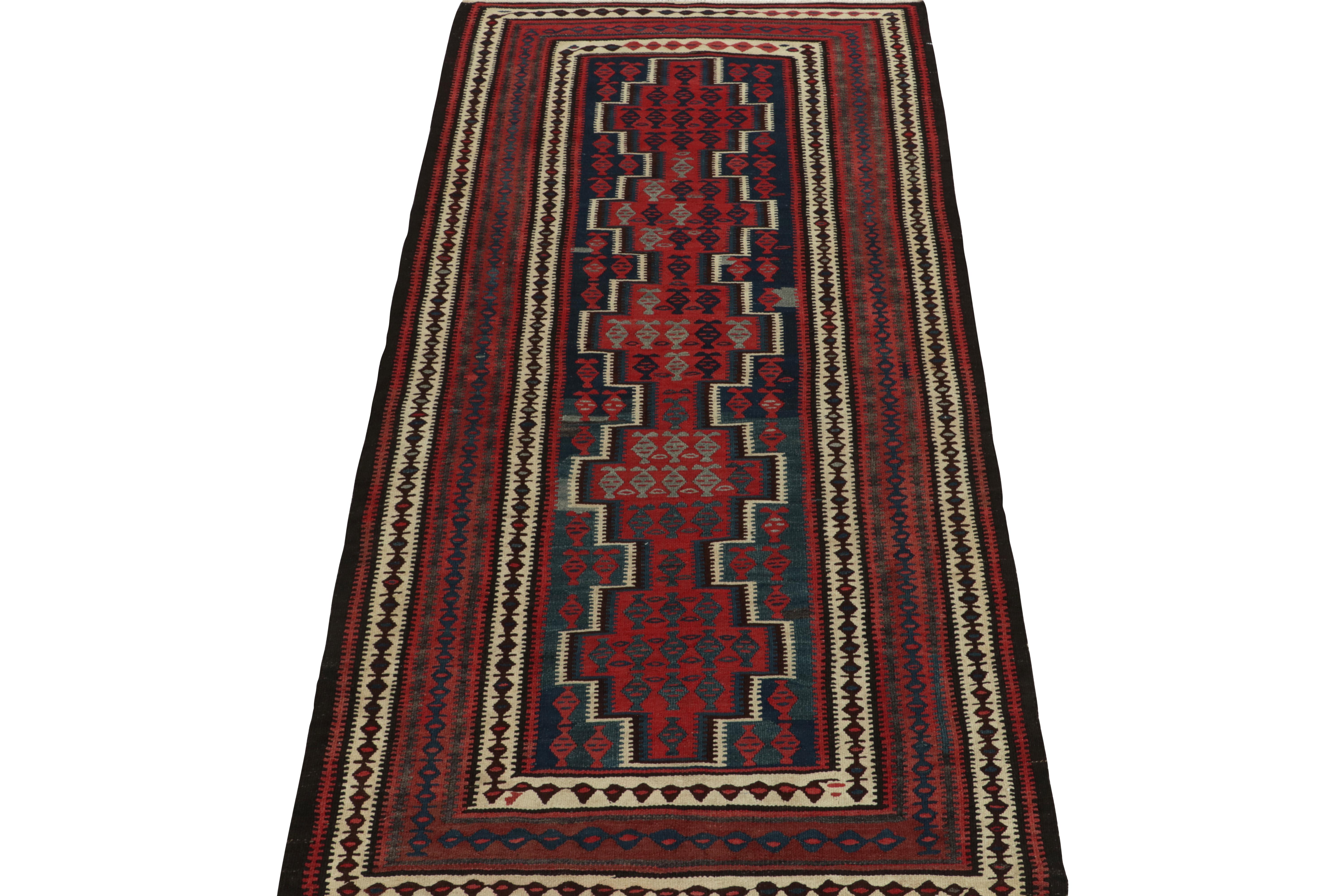 Tribal 1950s Vintage Kilim rug in Red, Blue and Brown Geometric Patterns by Rug & Kilim For Sale