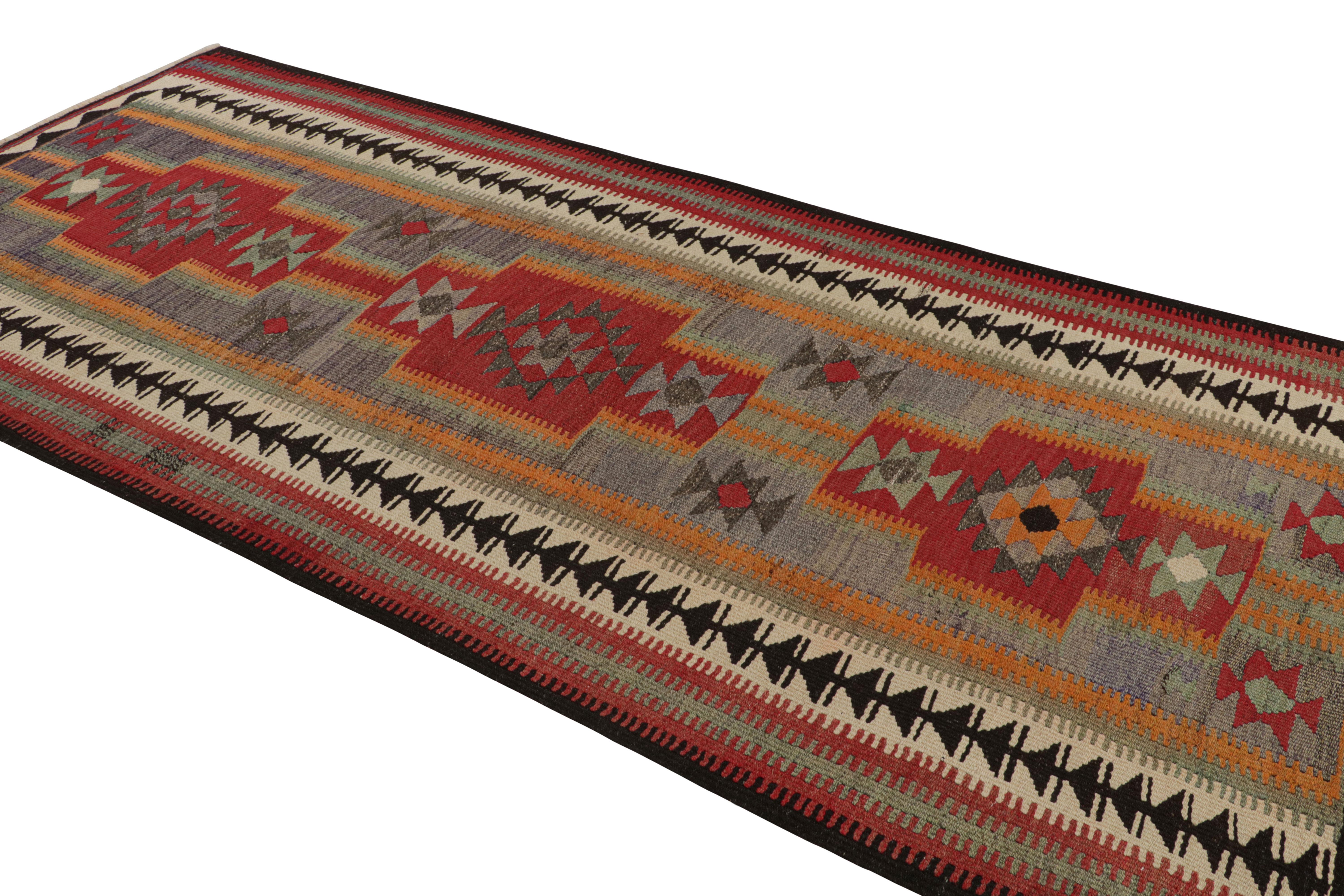 Persian 1950s Vintage Kilim rug in Red Blue, Multicolor Geometric Pattern by Rug & Kilim For Sale