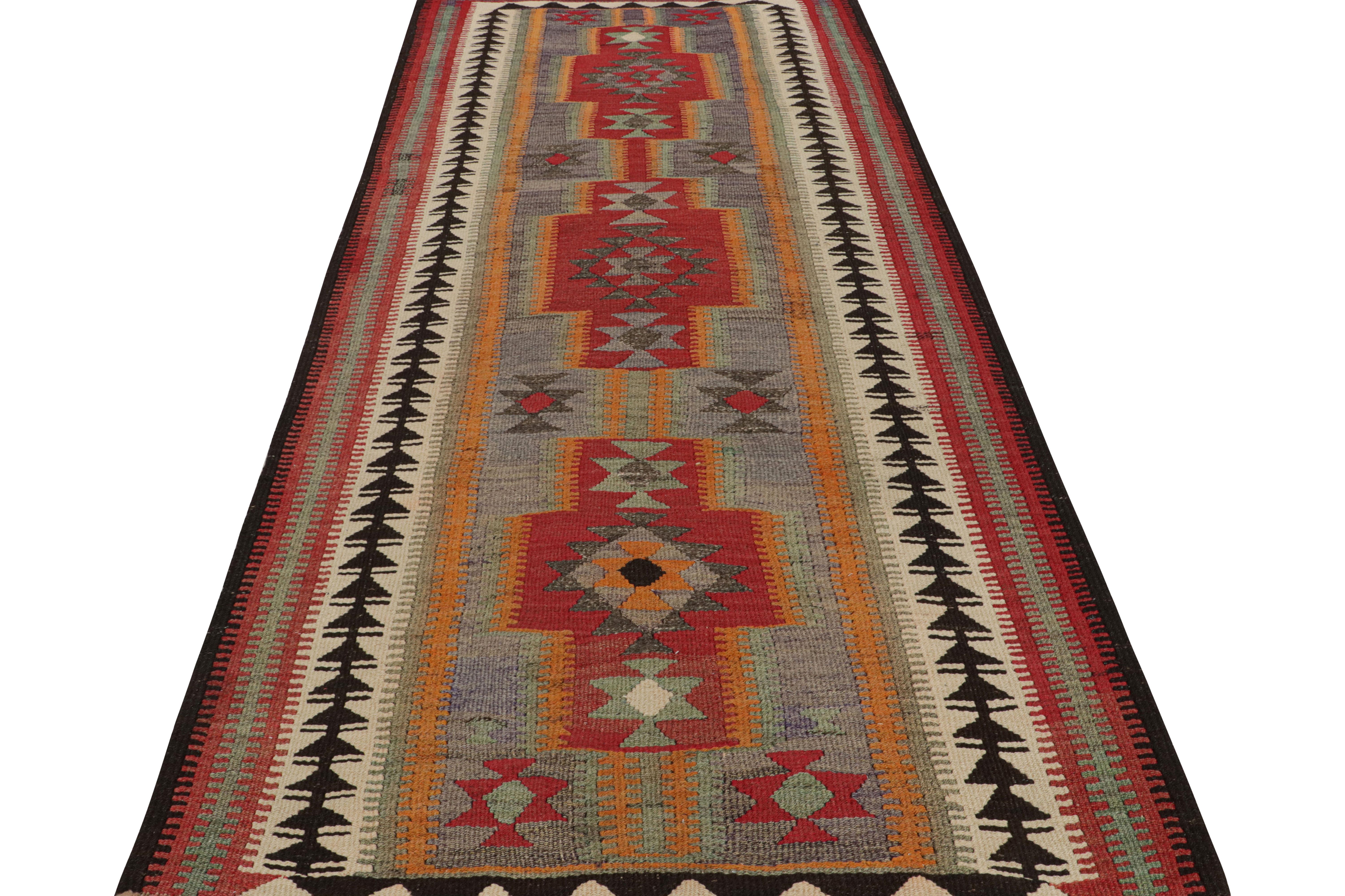 Hand-Woven 1950s Vintage Kilim rug in Red Blue, Multicolor Geometric Pattern by Rug & Kilim For Sale