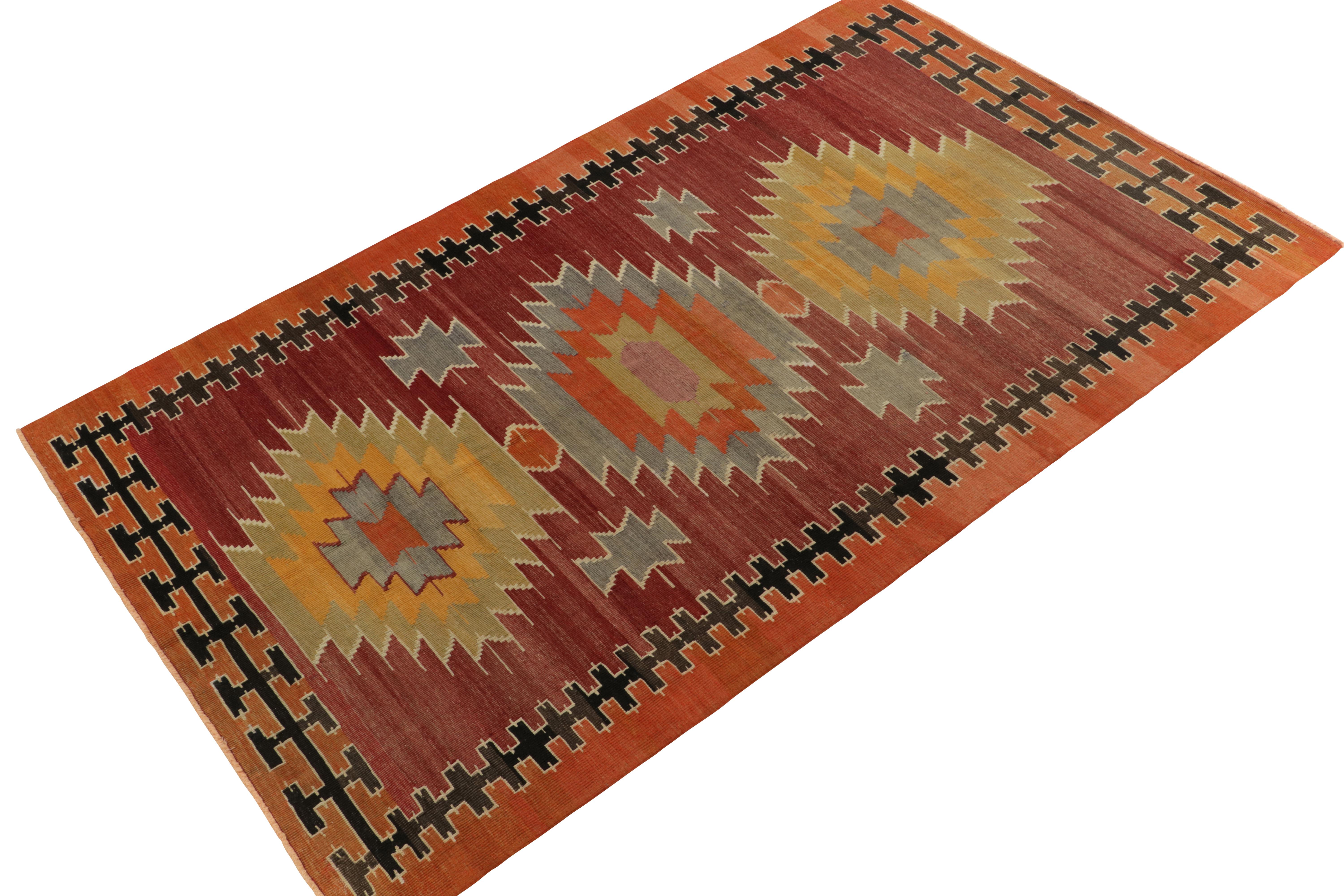 Hailing from rare turkish lineage, a vintage Mut kilim now unveiled from Rug & Kilim’s coveted tribal curations. This 6x9 rug enjoys an intricate medallion design in aegean blue, pista green, and canary yellow atop a tastefully abrashed red field