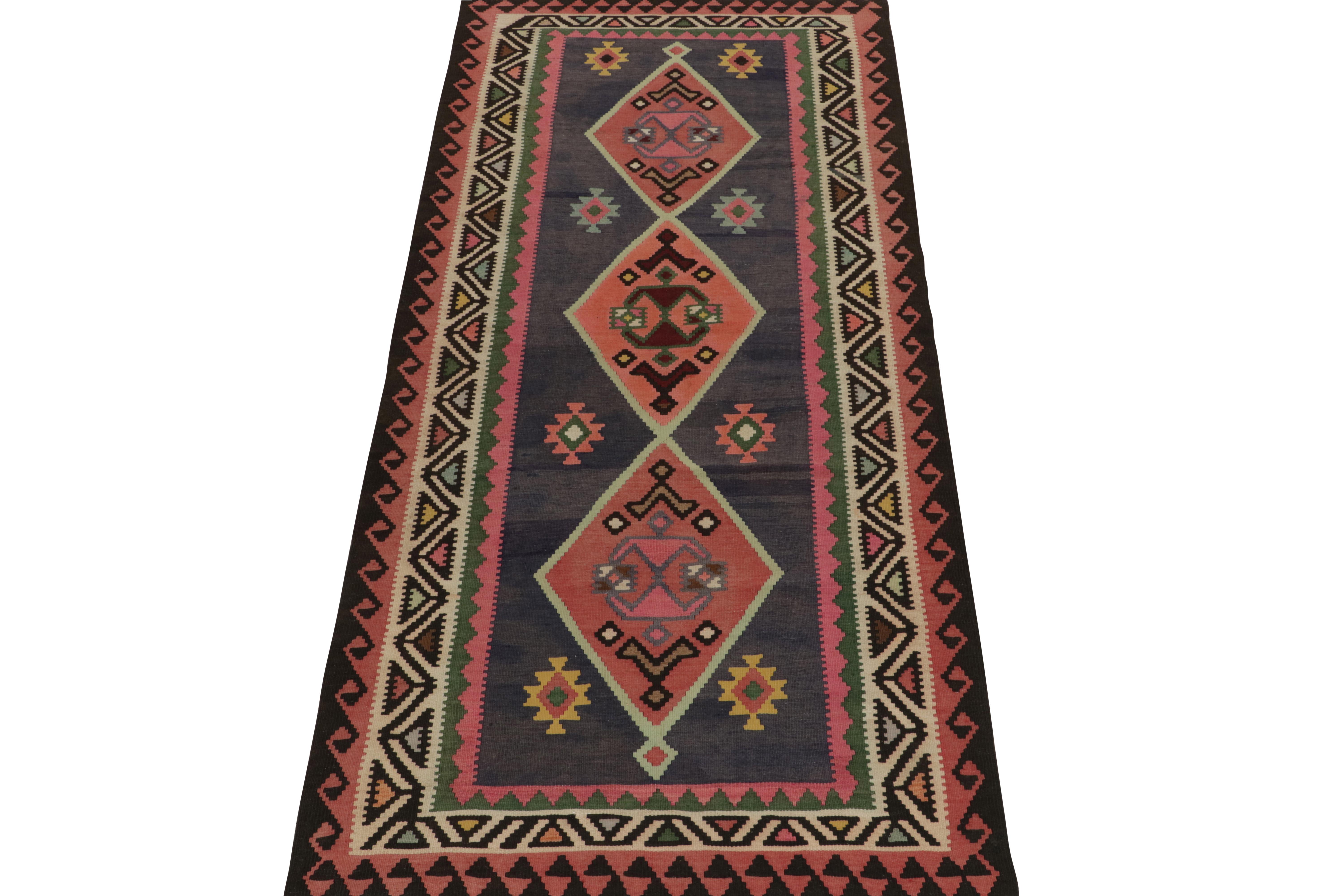Tribal 1950s Vintage Kilim rug with Pink , Vibrant Geometric Pattern by Rug & Kilim For Sale