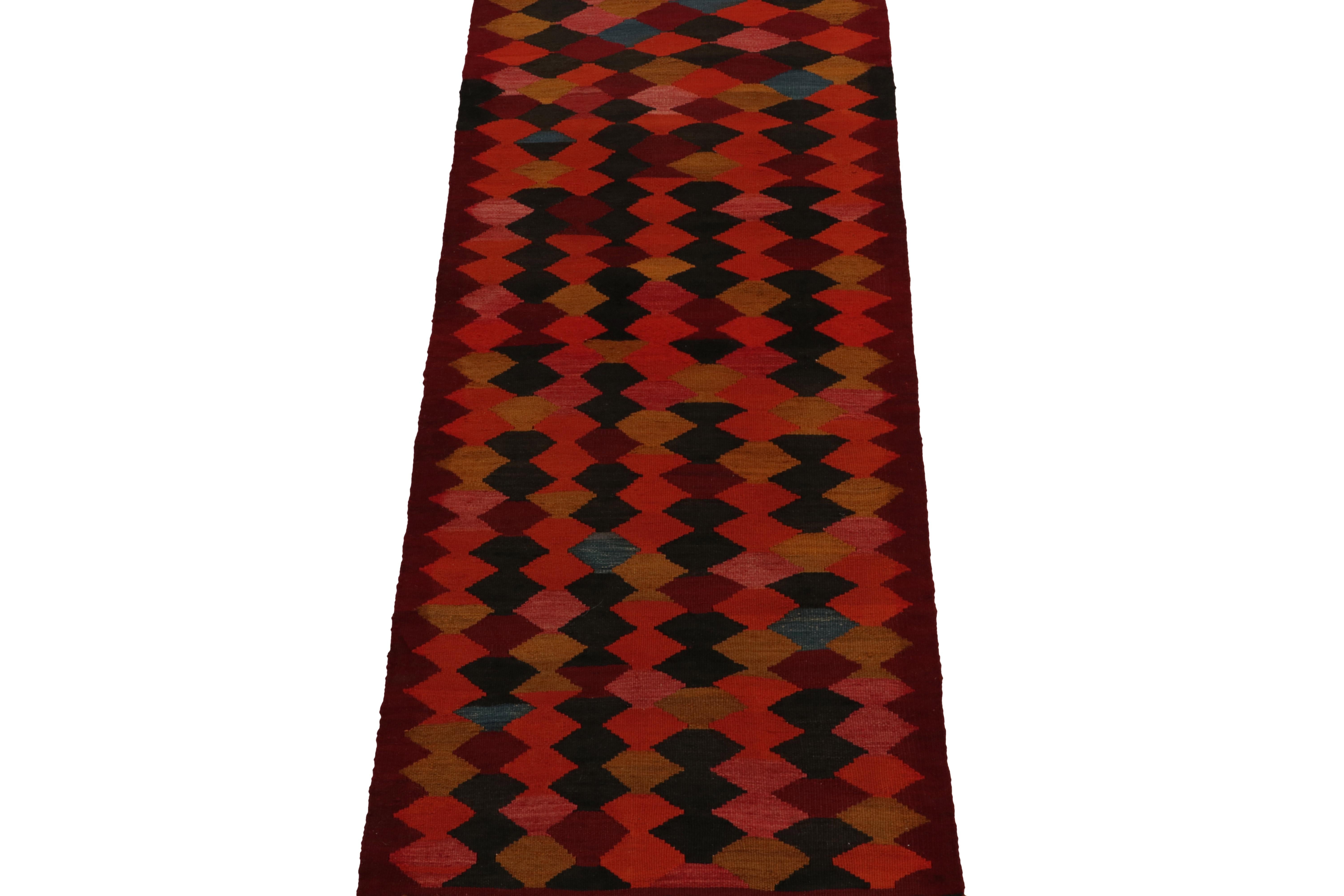 Handwoven in wool circa 1950-1960, a rare mid-century curation of small-sized Kilim runners new to our classic tribal collection.

Distinguished from one our principal’s favorite Persian workshops, the piece carries a unique attitude and