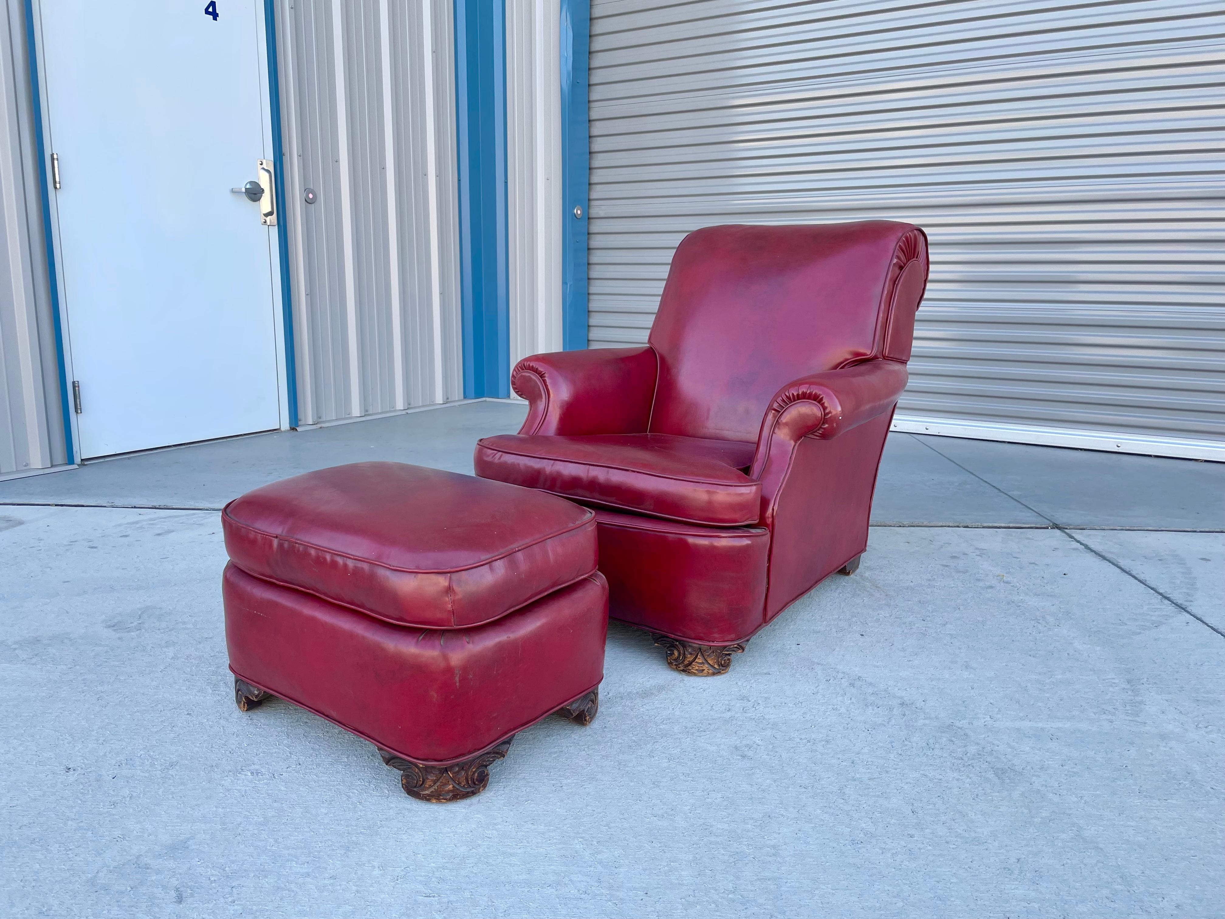 Vintage leather chair & ottoman designed and manufactured in the United States circa 1950s. This amazing set features a stunning red leather upholstery that sits on four sturdy wooden legs. The craftsmanship and attention to detail on this piece is