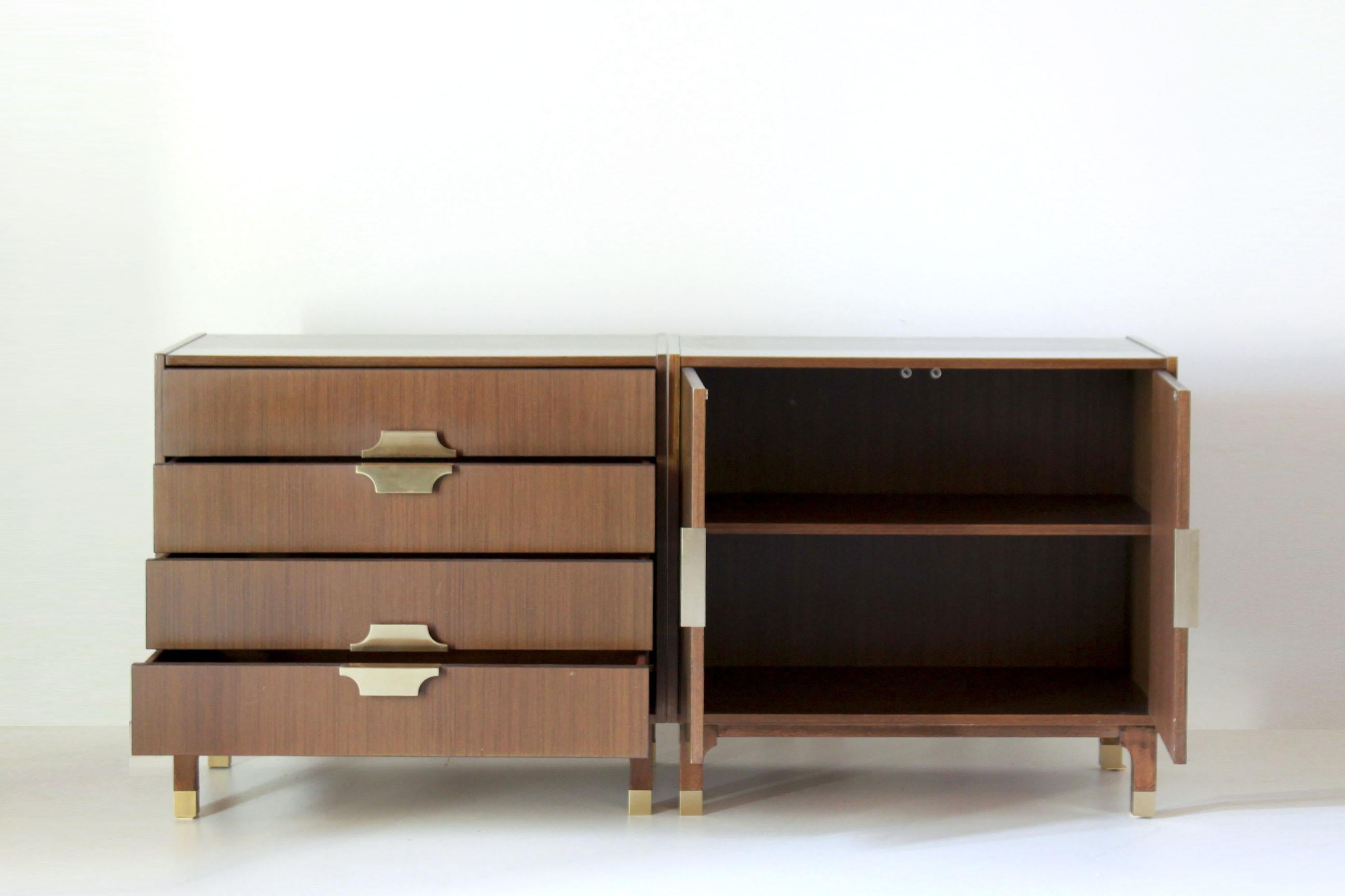 A 1950s vintage sideboard with modular structure. Composed by two different parts, Veereed in mahogany with brass handles. In really good conditions with only some signs of time. All parts are the original ones.