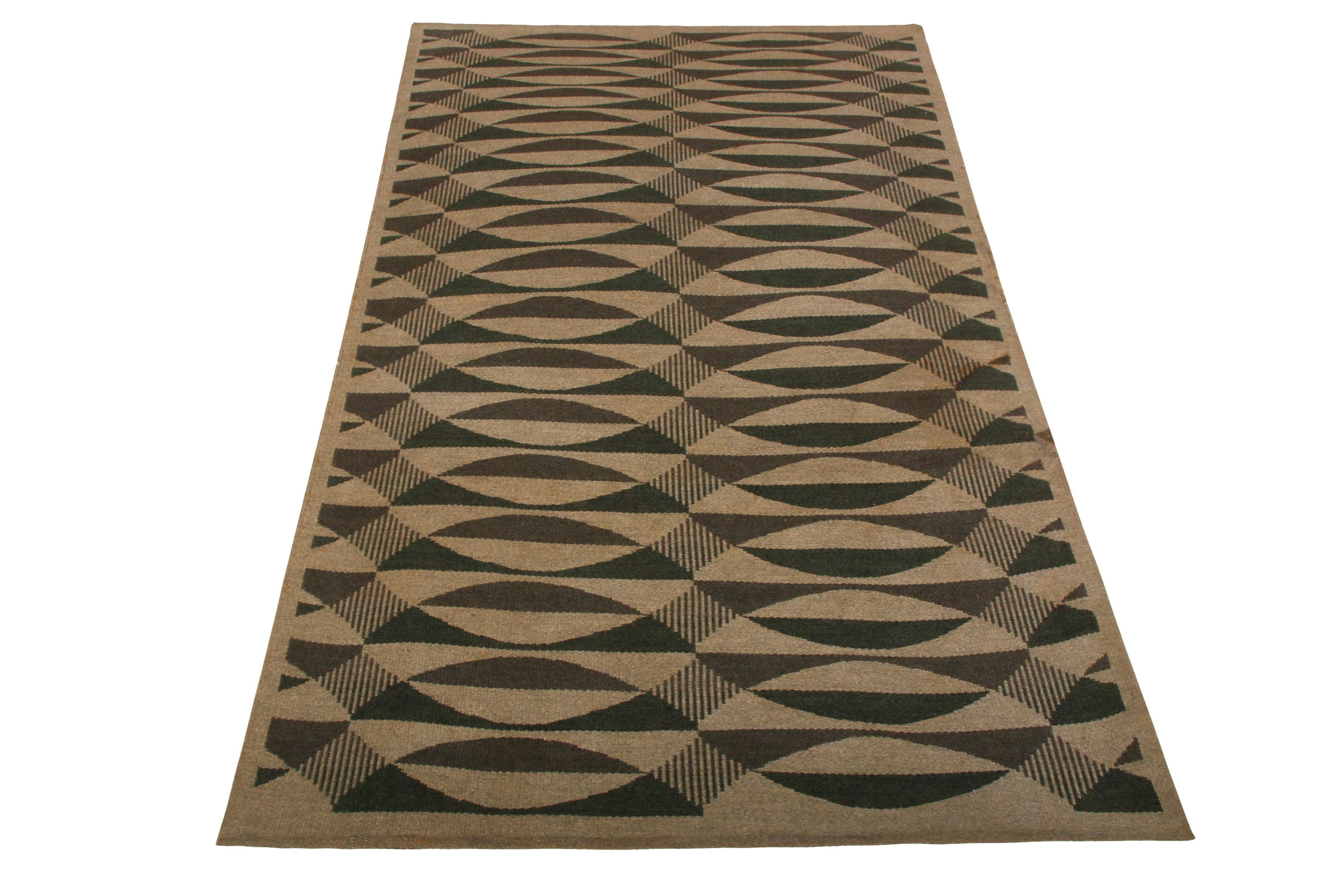 Handwoven in wool originating from Scandinavia, this vintage midcentury flat-weave enjoys a hypnotic play of color and pattern in the marriage of the rustic beige-brown with a subtle green accent in the geometric pattern. The play of the
