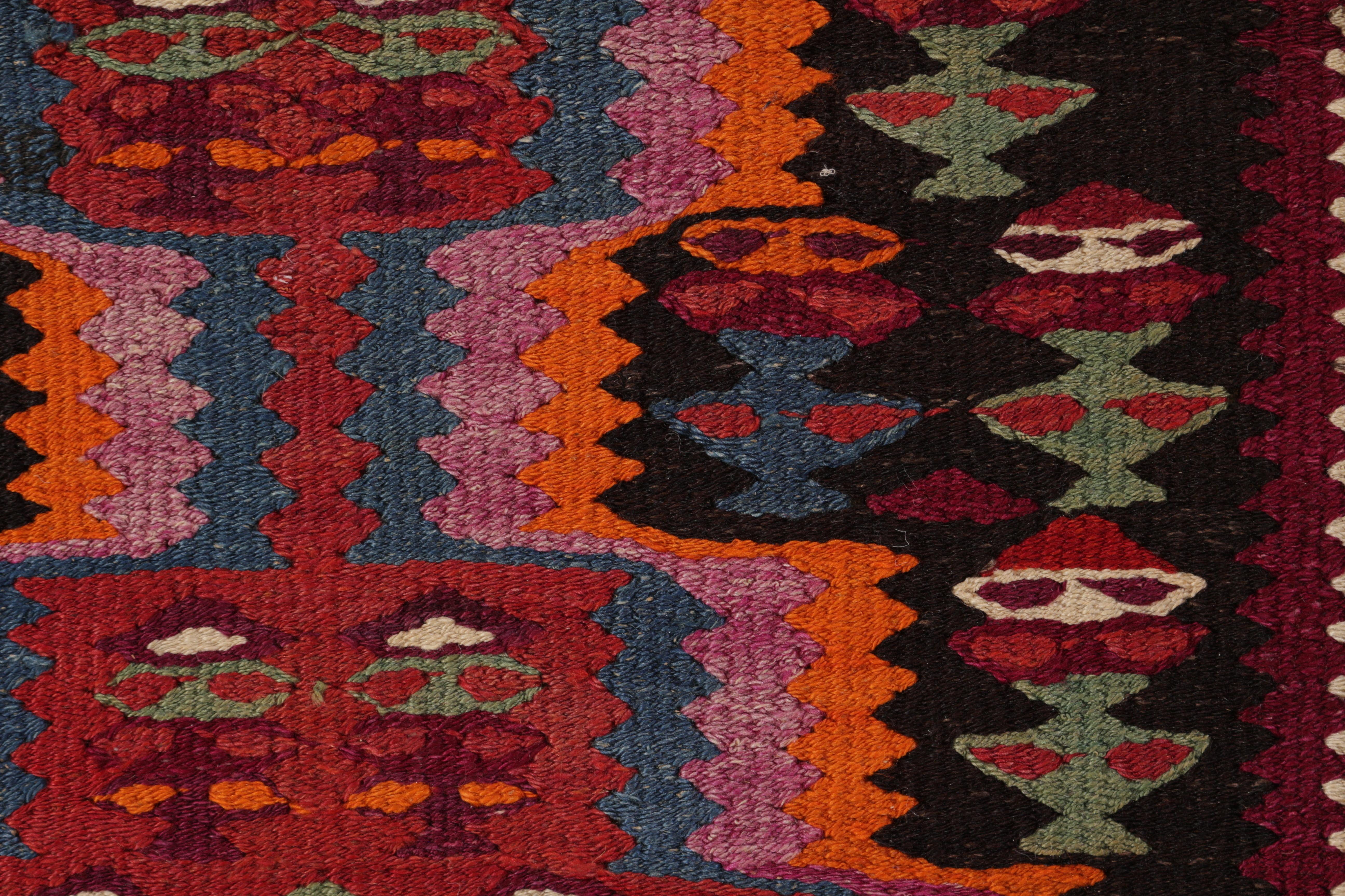 Handmade in a particularly full, durable flat-woven wool circa 1950-1960, this vintage Persian Kilim originates from the Harsin region of midcentury Kermanshah Kilim design, the period and locale remarking the superb quality and equally meticulous
