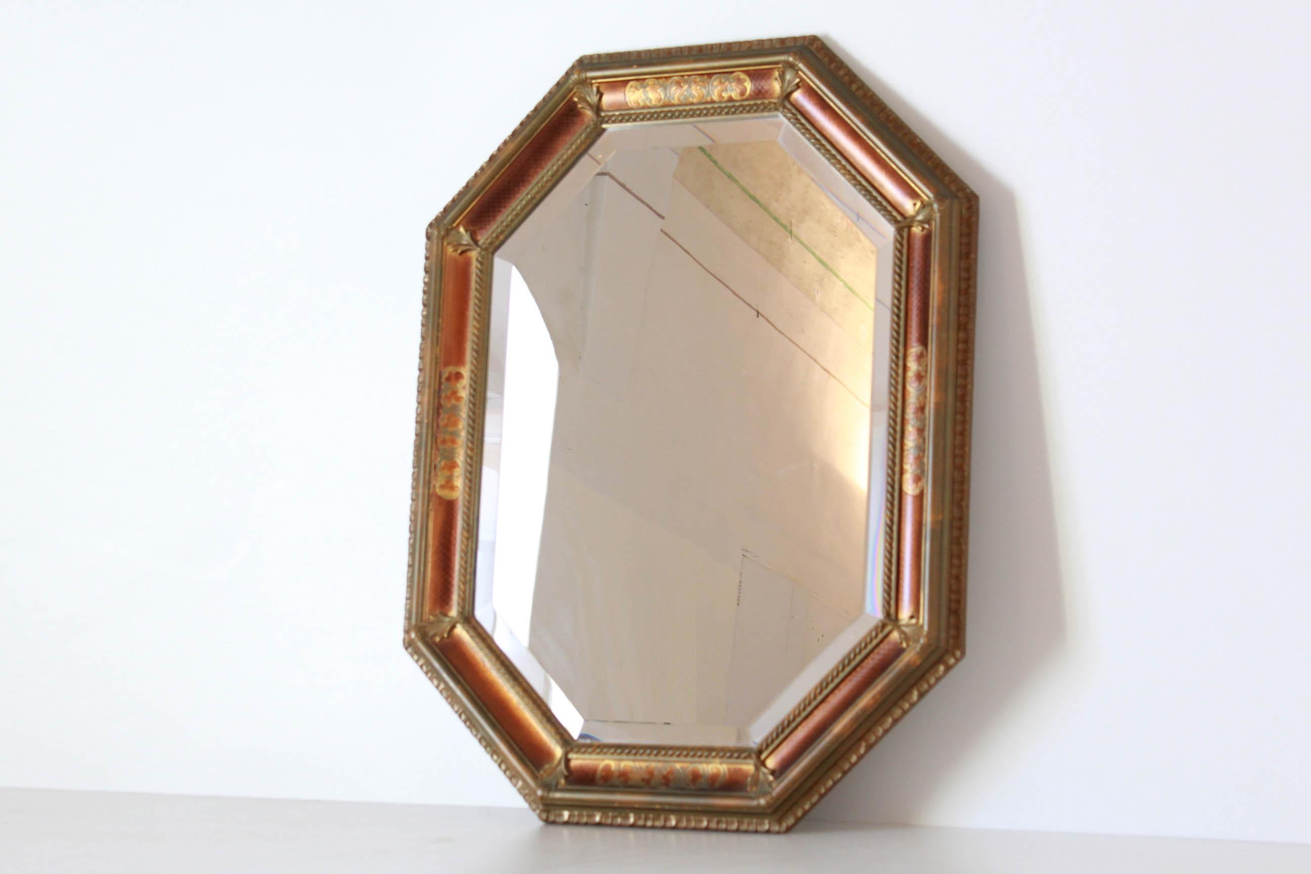 Vintage Golden Wood Mirror in Baroque Style, Italy 1950s
A 1950s vintage mirror in pure baroque style. Wood golden frame with a fine pentagonal shape. Original mirror glass. In very good conditions with beautiful signs of time.