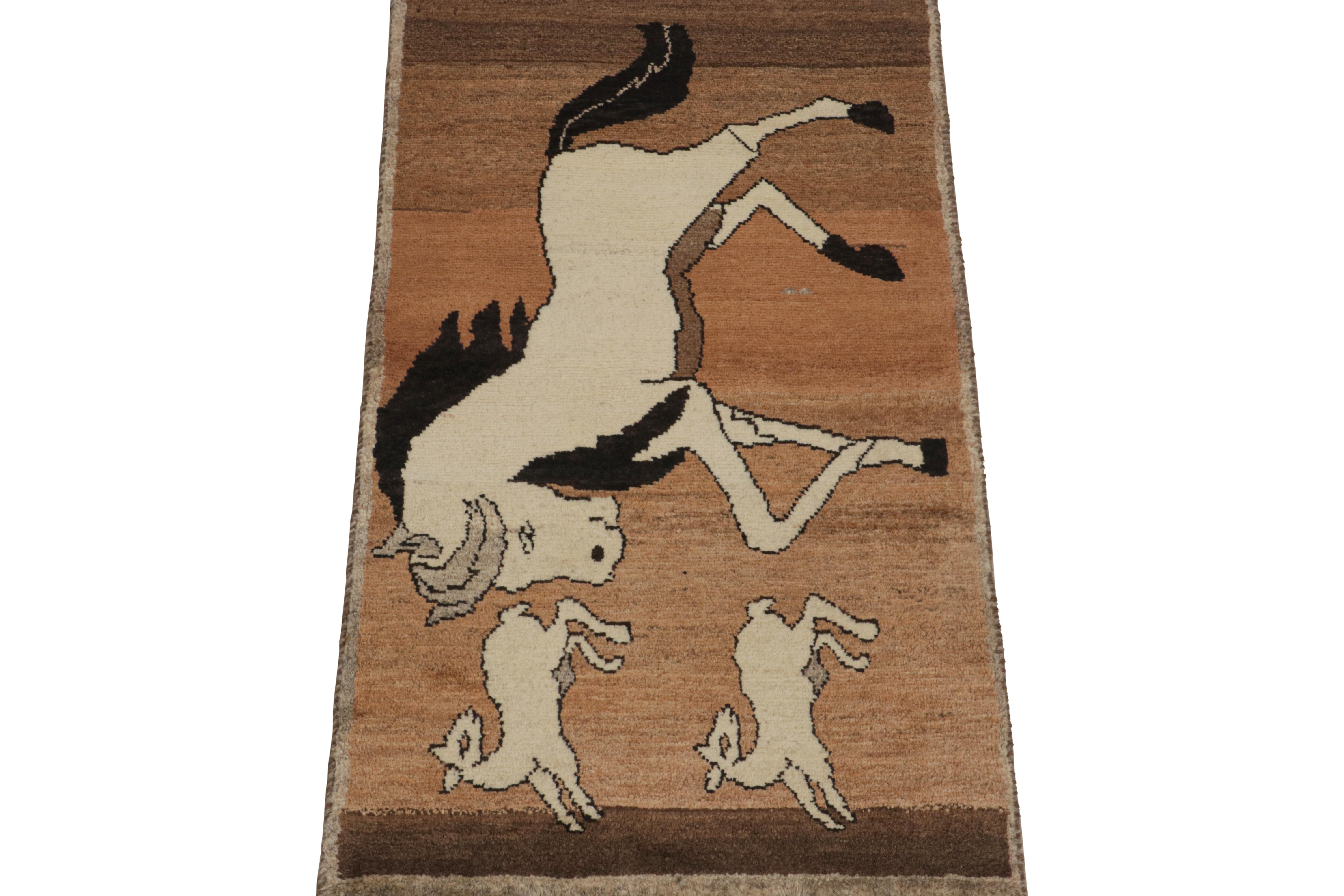 This vintage 2x5 Persian rug is a rare mid-century tribal piece, hand-knotted in wool circa 1950-1960.

Its design enjoys three pictorial horse patterns over a rich beige-brown field—one in large size and two smaller ones in off-white with black