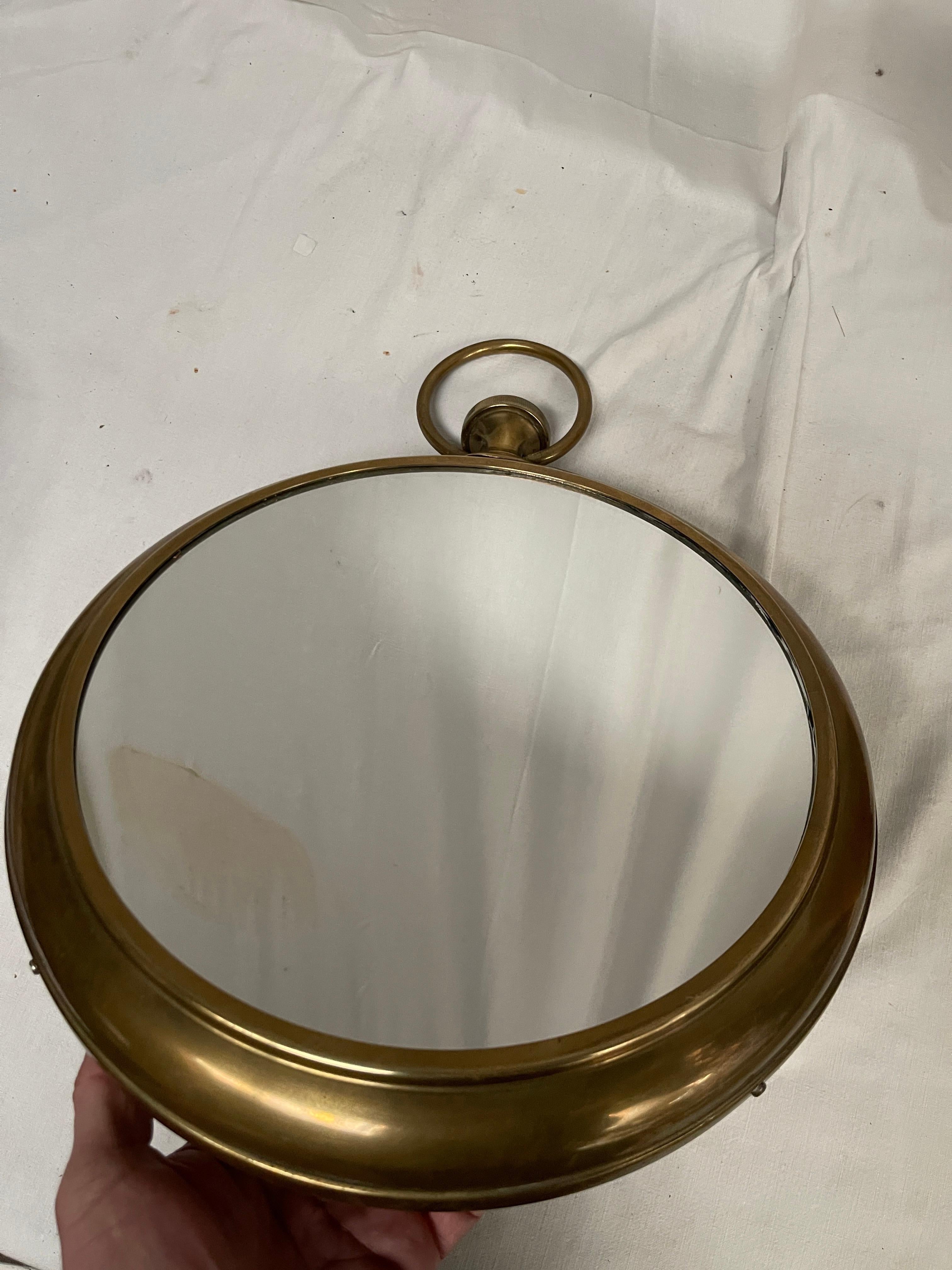 1950's brass wall mirror as a pocked watch
France
