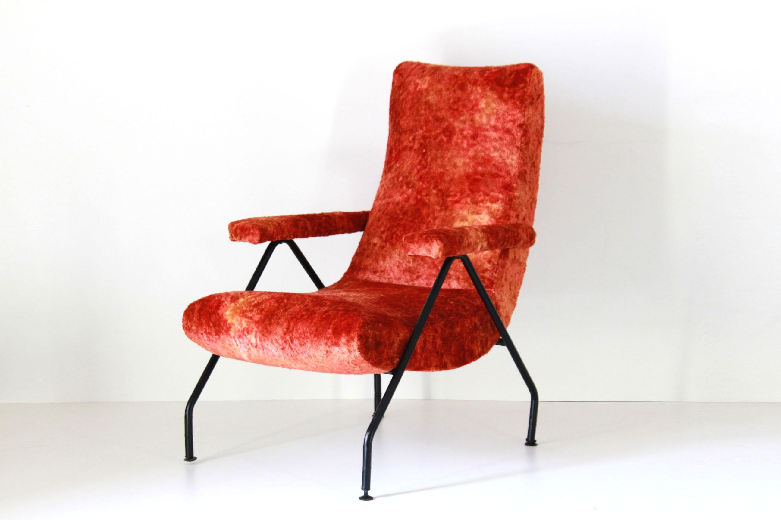 A 1950s vintage armchair with red cover and iron structure. The item has been fully restored. In excellent conditions.