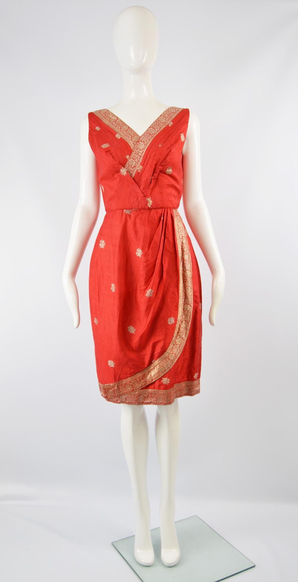 An incredibly chic vintage women's asian sleeveless dress from the late 50s / early 60s by Rose Gown Shop of Singapore. In a red silk with a sari inspired gold metallic brocade woven throughout for a truly glamorous effect, perfect for a bombshell