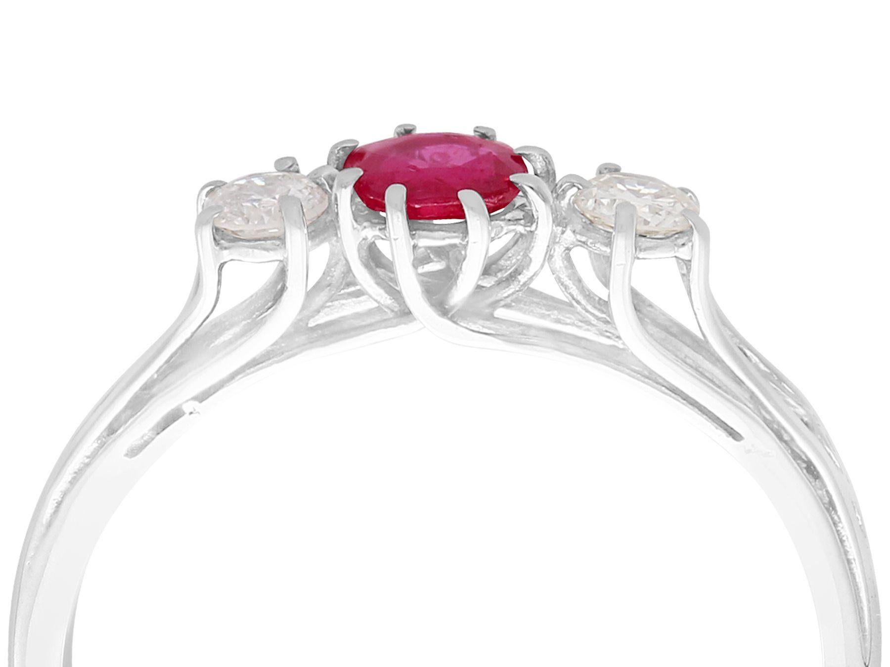 A very good vintage 0.56 carat ruby and 0.25 carat diamond, 18 karat white gold, multi strand trilogy/three stone ring; part of our vintage jewelry and estate jewelry collections

This very good ruby and diamond dress ring has been crafted in 18k