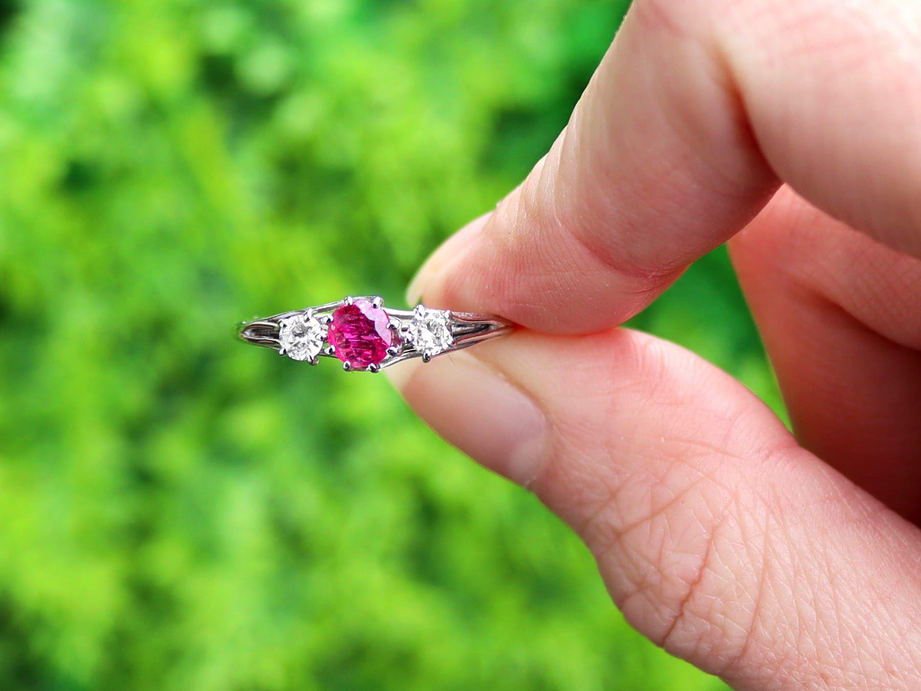 A fine and impressive vintage 0.56 carat ruby and 0.25 carat diamond, 18 karat white gold multi strand trilogy/three stone ring; part of our vintage jewellery and estate jewelry collections.

This fine and impressive vintage trilogy ring has been
