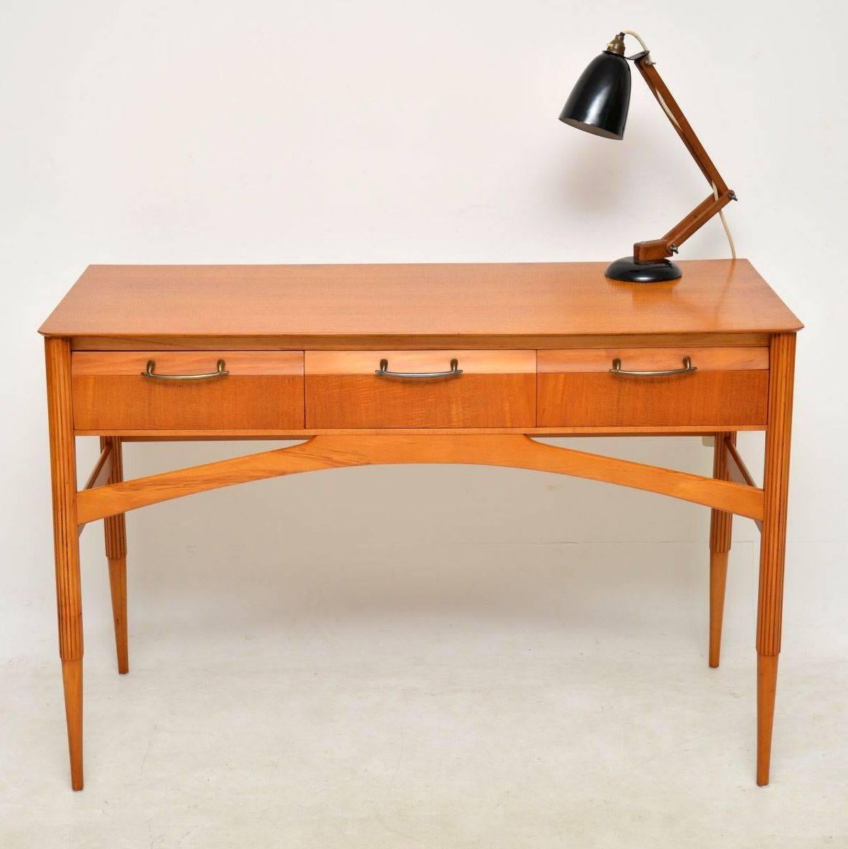 A beautifully designed and top quality vintage desk in satinwood, this dates from the 1950’s. It was originally a dressing table but is a perfect size for a desk, so could be used as either really. We have had this stripped and re-polished to a very