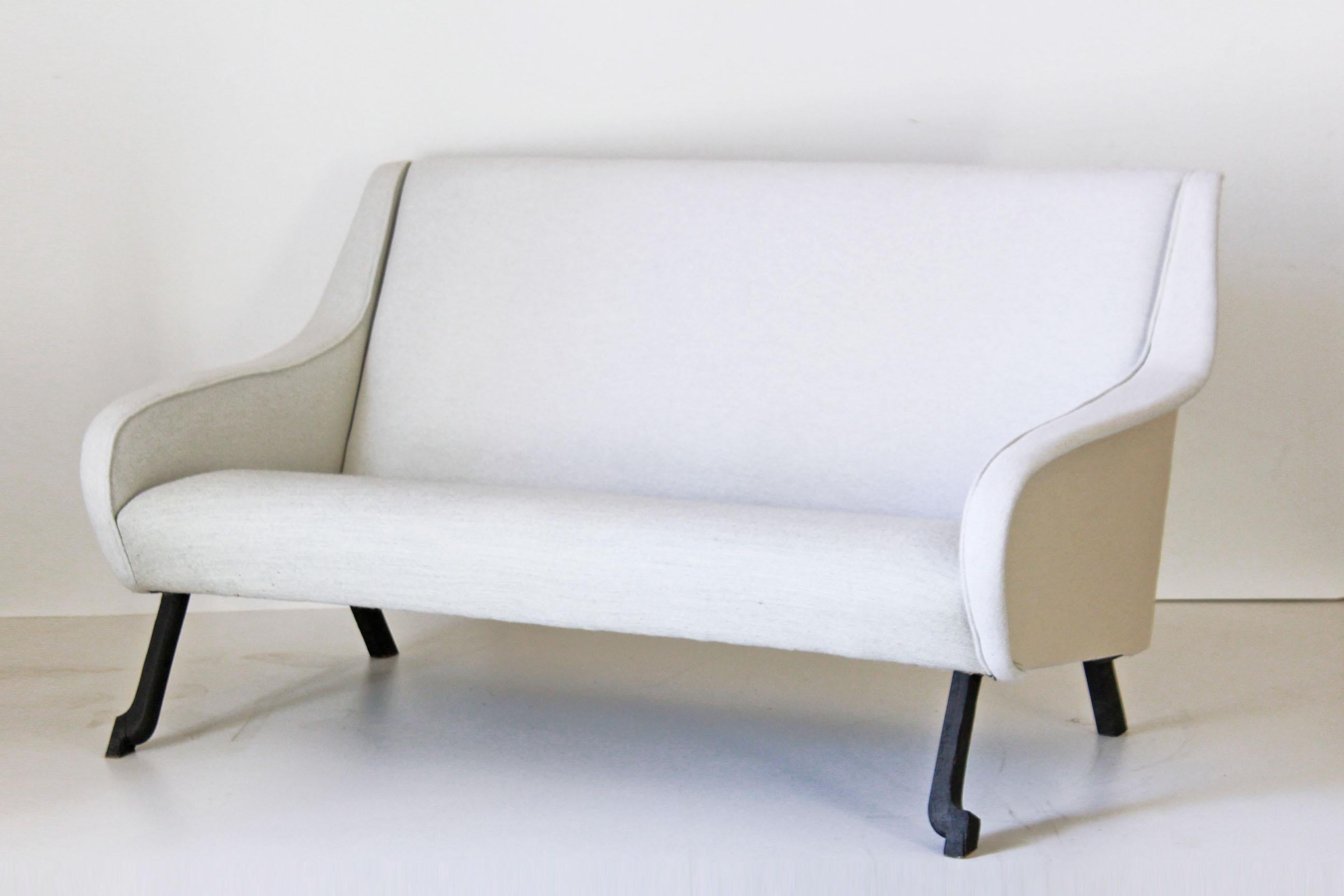 A 1950s two seats vintage sofa with fabric cover and wood legs. Wood legs have been traited through the use of Japanese wood preserving technique 