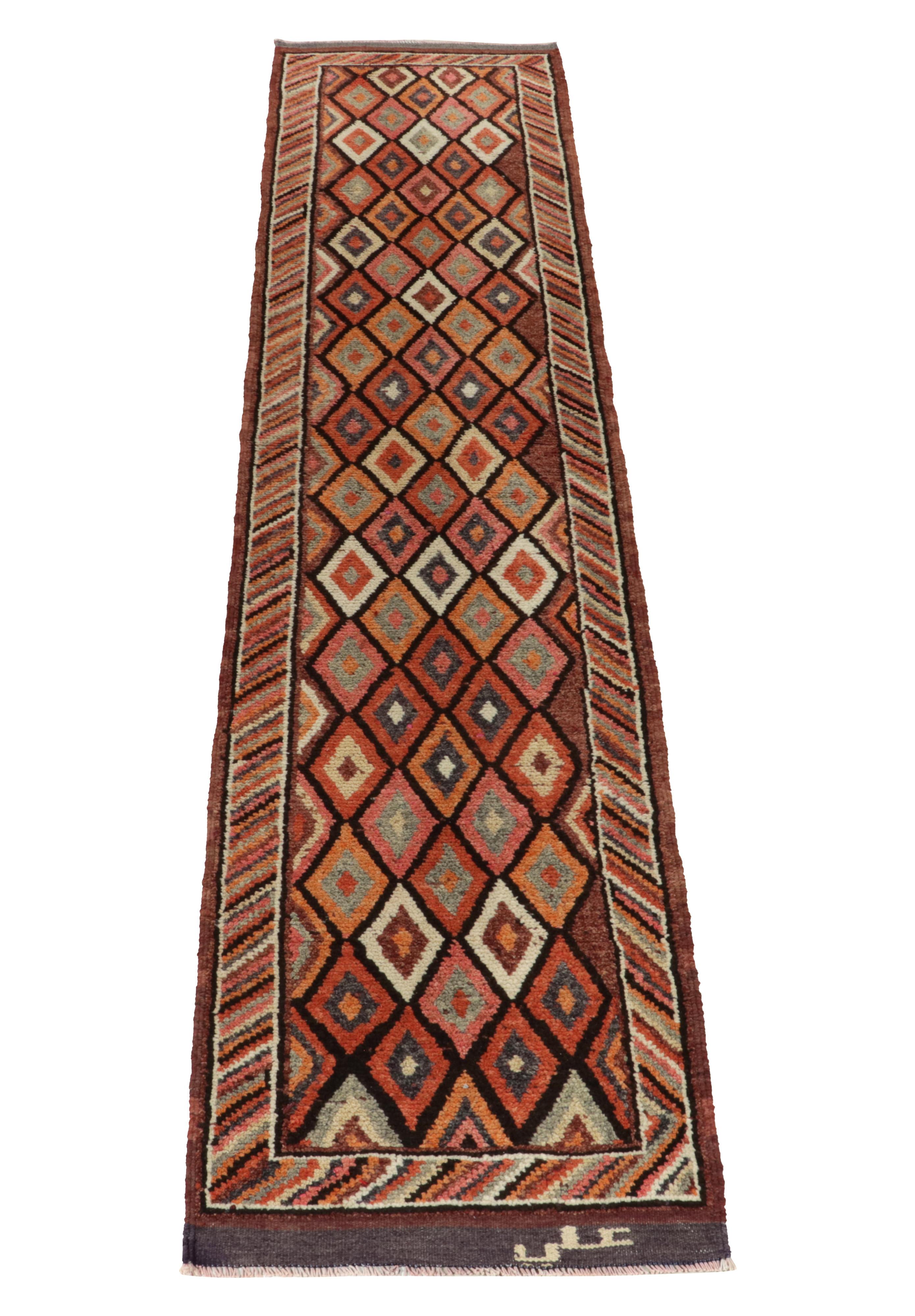 Hand-knotted in wool, a 3x13 vintage runner from Rug & Kilim’s prominent new curation of rare tribal pieces. 

Originating from Turkey circa 1950-1960, the drawing relishes in rich orange, pink, red & black with scintillating movement in a series