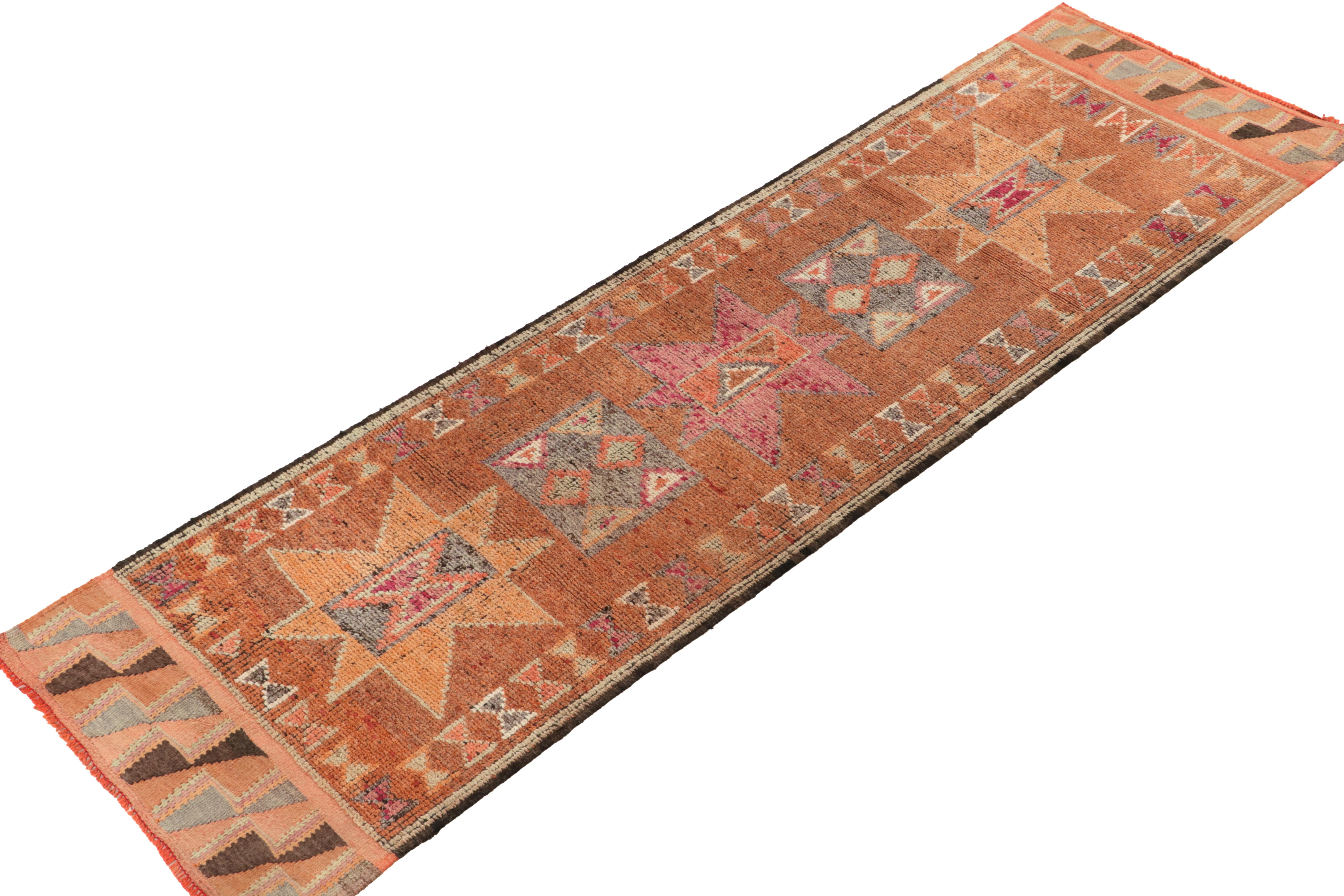 Hand-knotted in wool, a 3x11 runner from Rug & Kilim’s newest curation of extremely collectible tribal pieces. 

Originating from Turkey circa 1950-1960, the rug enjoys traditional medallions on the field in warm orange, gray, pink & brown. The