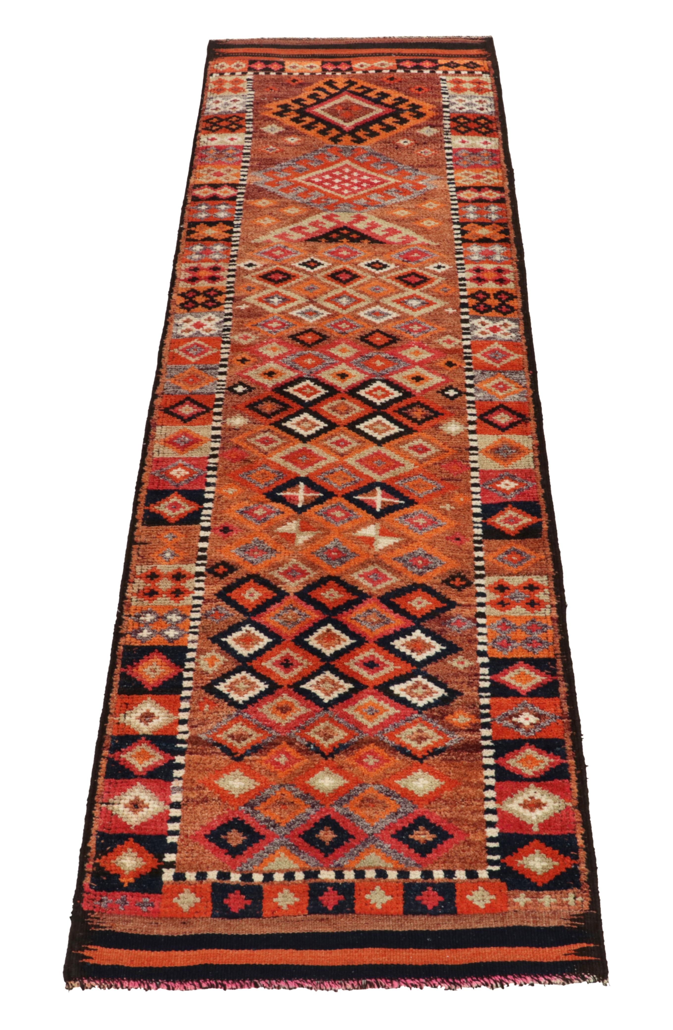 Hand-knotted in wool, a 3x10 runner from Rug & Kilim’s latest curation of rare tribal rugs. 

Originating from Turkey circa 1950-1960, the piece enjoys diamond patterns with latch hooks on the field outlined by traditional motifs in rich tones of