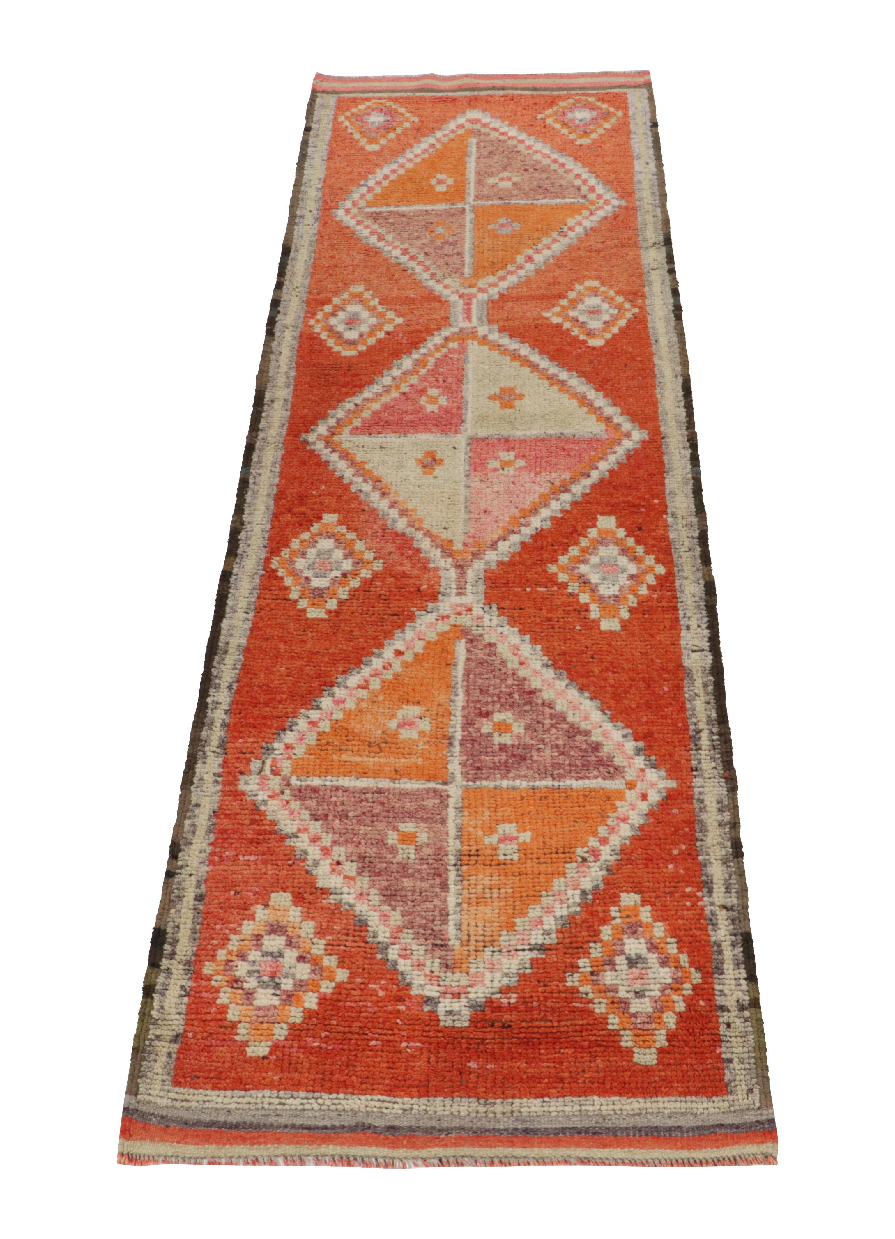 Hand-knotted in wool, a vintage 3x11 runner from Rug & Kilim’s latest bold, rare tribal rug curations. 

Originating from Turkey circa 1950-1960, the drawing highlights the lively aspect of tribal aesthetics through playful tones of orange, red