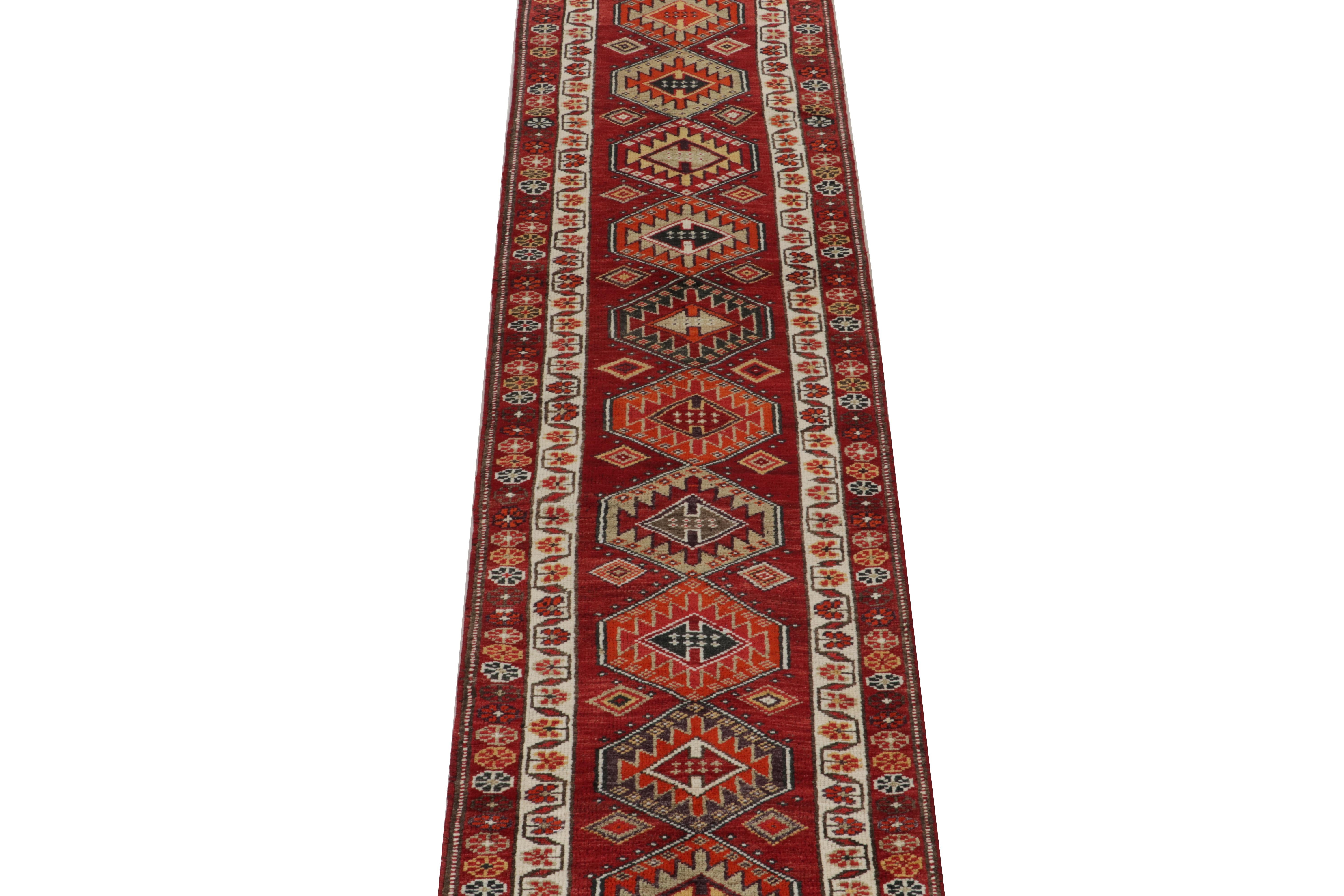 Hand-knotted in wool, a stupendous 3x13 vintage runner from Rug & Kilim’s latest curation of rare tribal rugs. Originating from Turkey circa 1950-1960, a piece as rare in size as it is rich in colorway and meticulous detail. 

The design enjoys a
