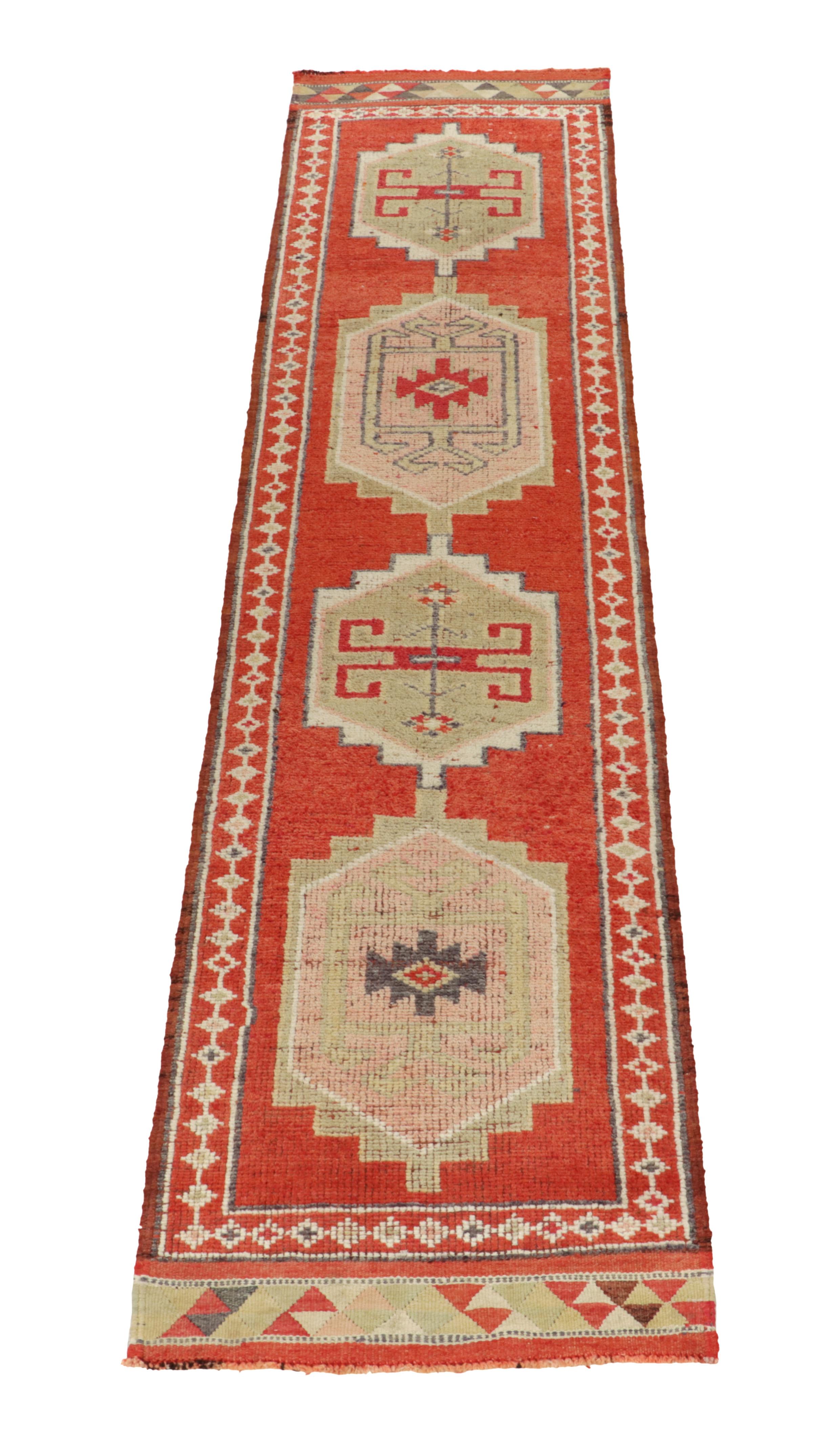Hand-knotted in wool, a vintage 3x12 runner from Rug & Kilim’s coveted new curation of rare tribal rugs.

Originating from Turkey circa 1950-1960, the design enjoys traditional motifs in more transitional, yet rich tones of carrot red, pink, beige