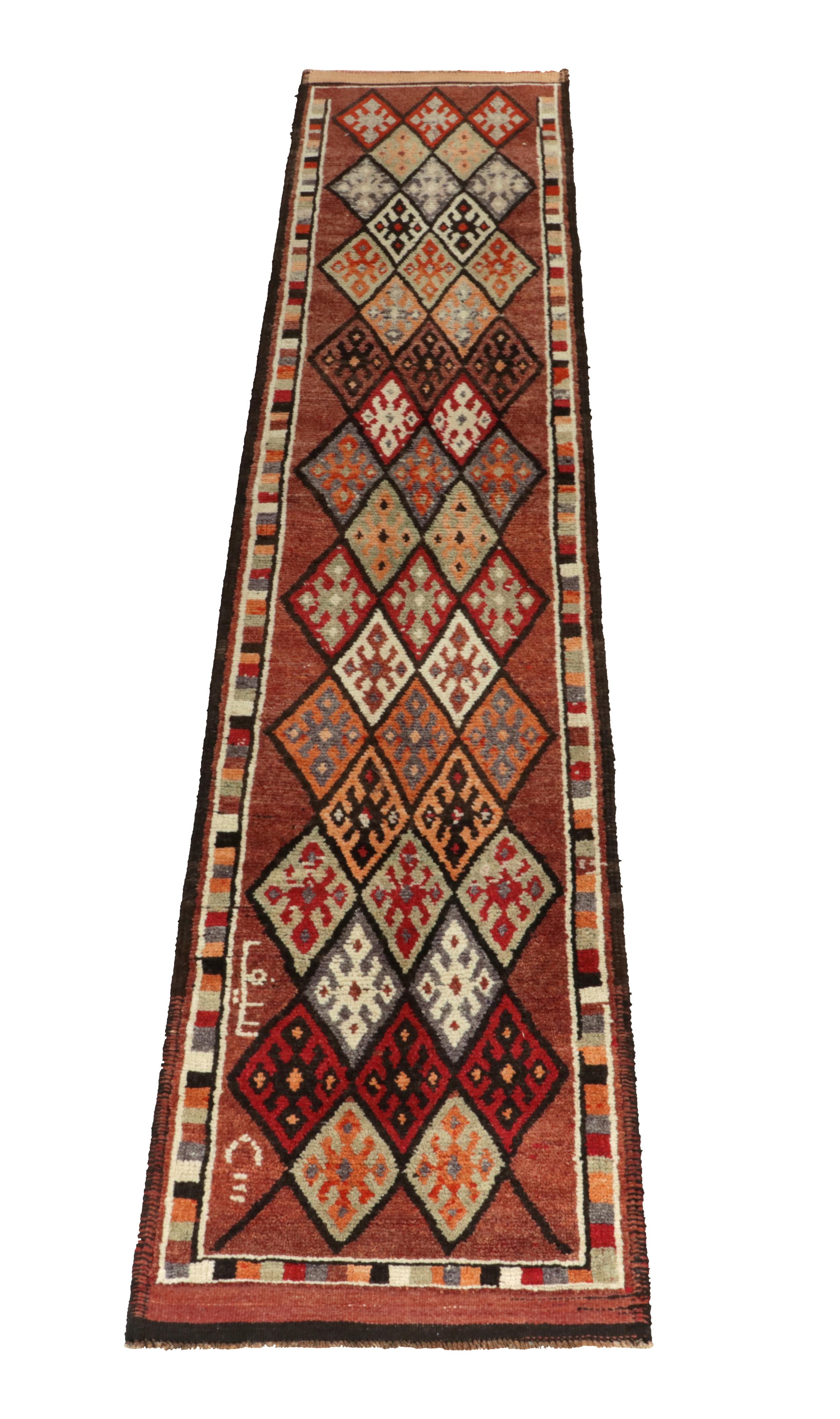 Hand-knotted in wool, a 3x13 runner from Rug & Kilim’s latest prominent curation of rare, exciting tribal rugs. 

Originating from Turkey circa 1950-1960, the design enjoys diamond patterns encasing traditional motifs in rich tones of brown,