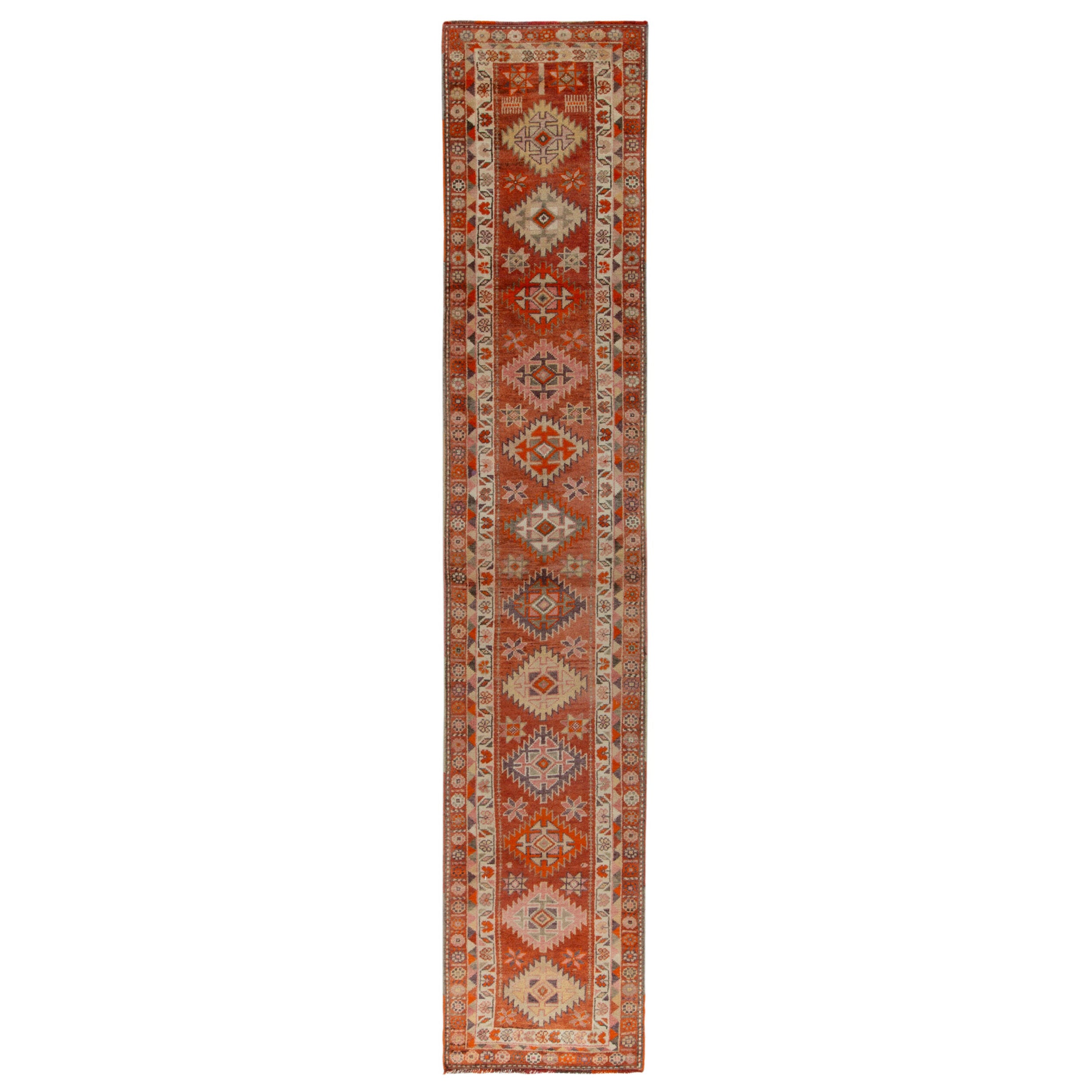 Runner tribale vintage degli anni '50 con motivi geometrici rossi, arancioni e beige-marroni
