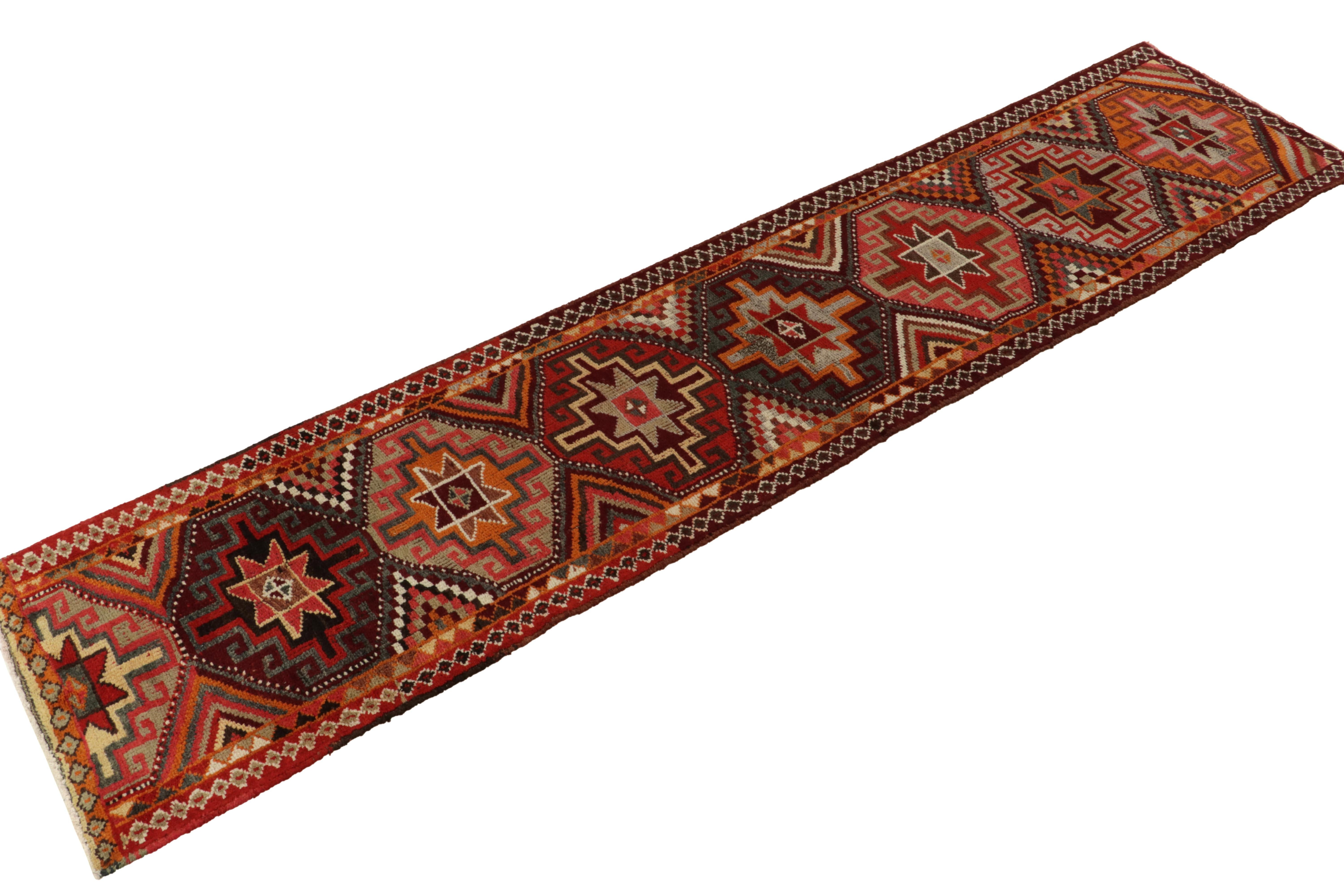 Hand-knotted in wool, a 3x13 runner from Rug & Kilim’s latest curation of rare tribal pieces. 

Originating from Turkey circa 1950-1960, the rug enjoys a series of repeating hexagonal star guls on the field—traditional motifs in rich tones of