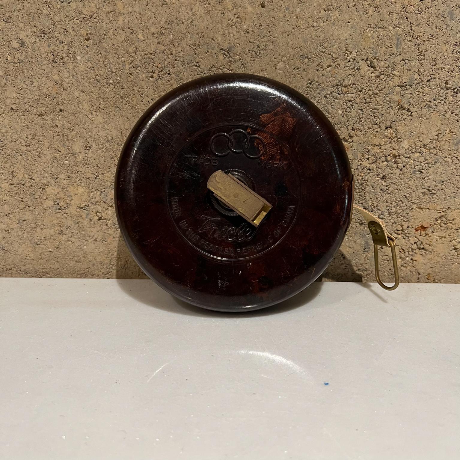 Vintage Tricle Bakelite Olympic tape Measure Peoples Republic of China
Wonderful vintage tape measure has a cover made from dappled rich dark colored bake-lite with gilt brass fittings and a cloth tape.
Made in the Peoples Republic of China
5.25