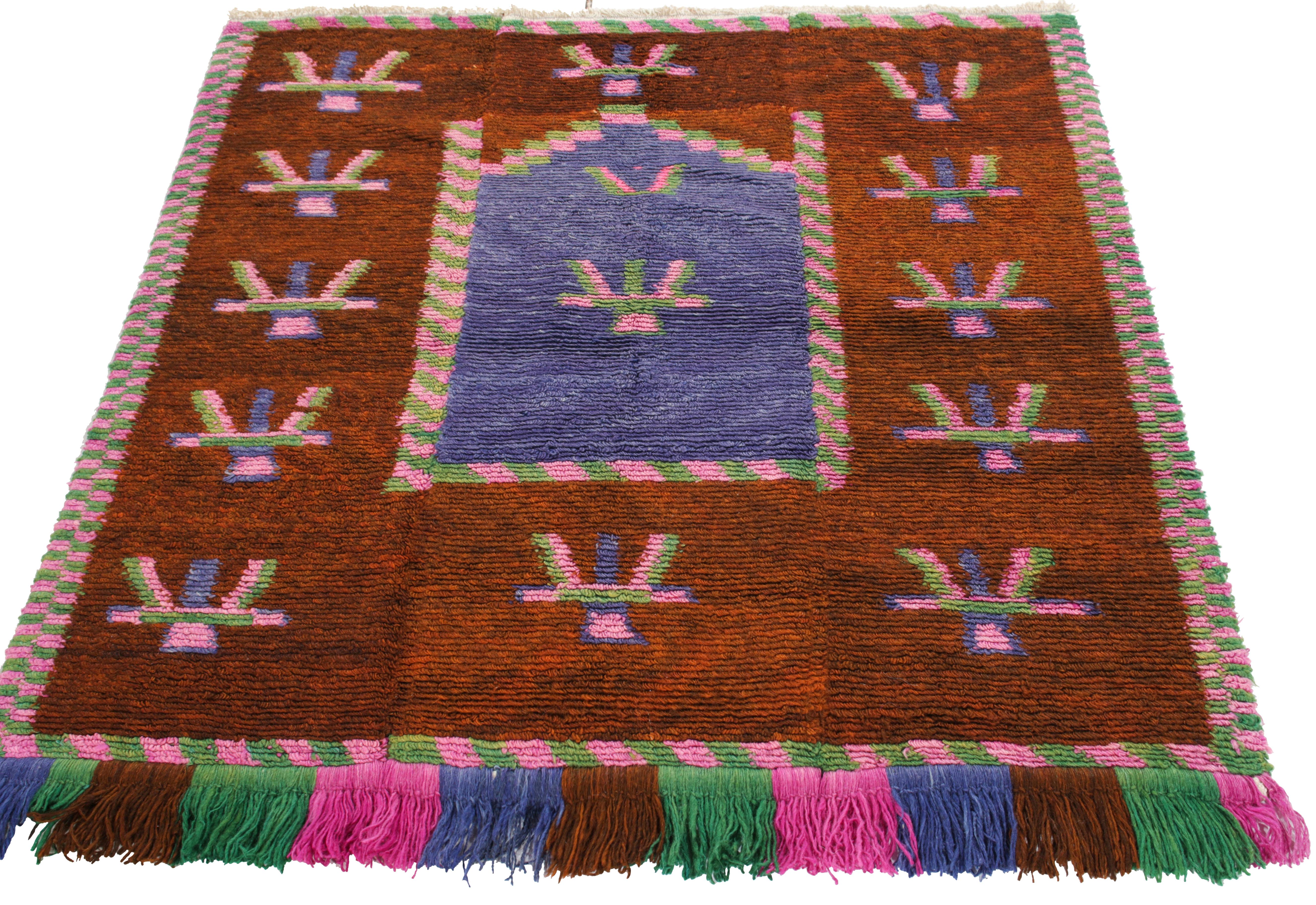 Hand-knotted in wool, a vintage Tulu originating from Turkey circa 1950-1960, now joining Rug & Kilim’s Antique & Vintage collection. The square sketch emanates nomadic sensibilities with traditional motifs in pink, green & blue sitting harmoniously