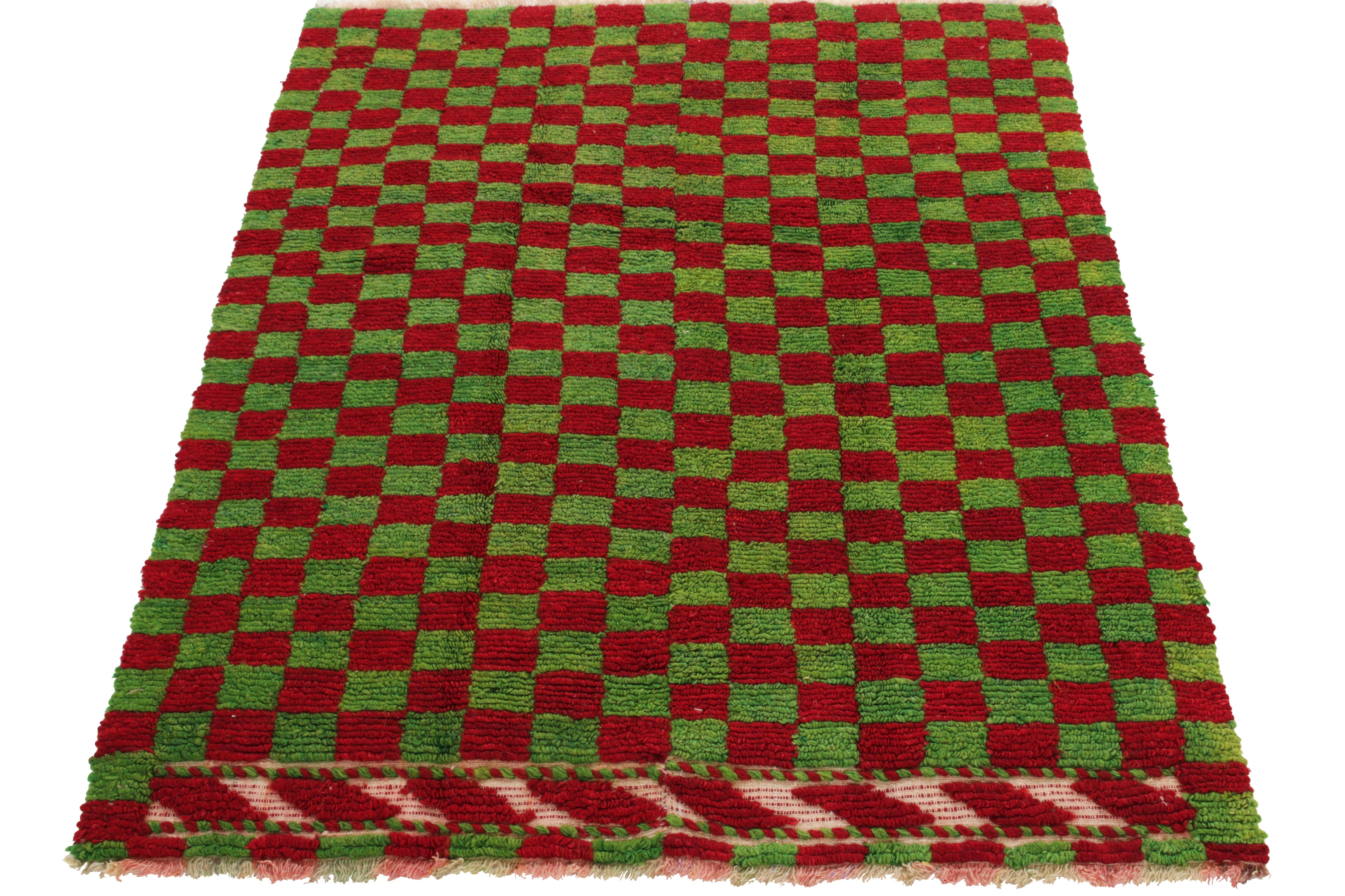 Hand-knotted in wool, a 4x5 vintage Tulu rug originating from Turkey circa 1950-1960, now joining Rug & Kilim’s Antique & Vintage collection. The healthy loop pile features a well defined checkered pattern in parrot green & scarlet red for an