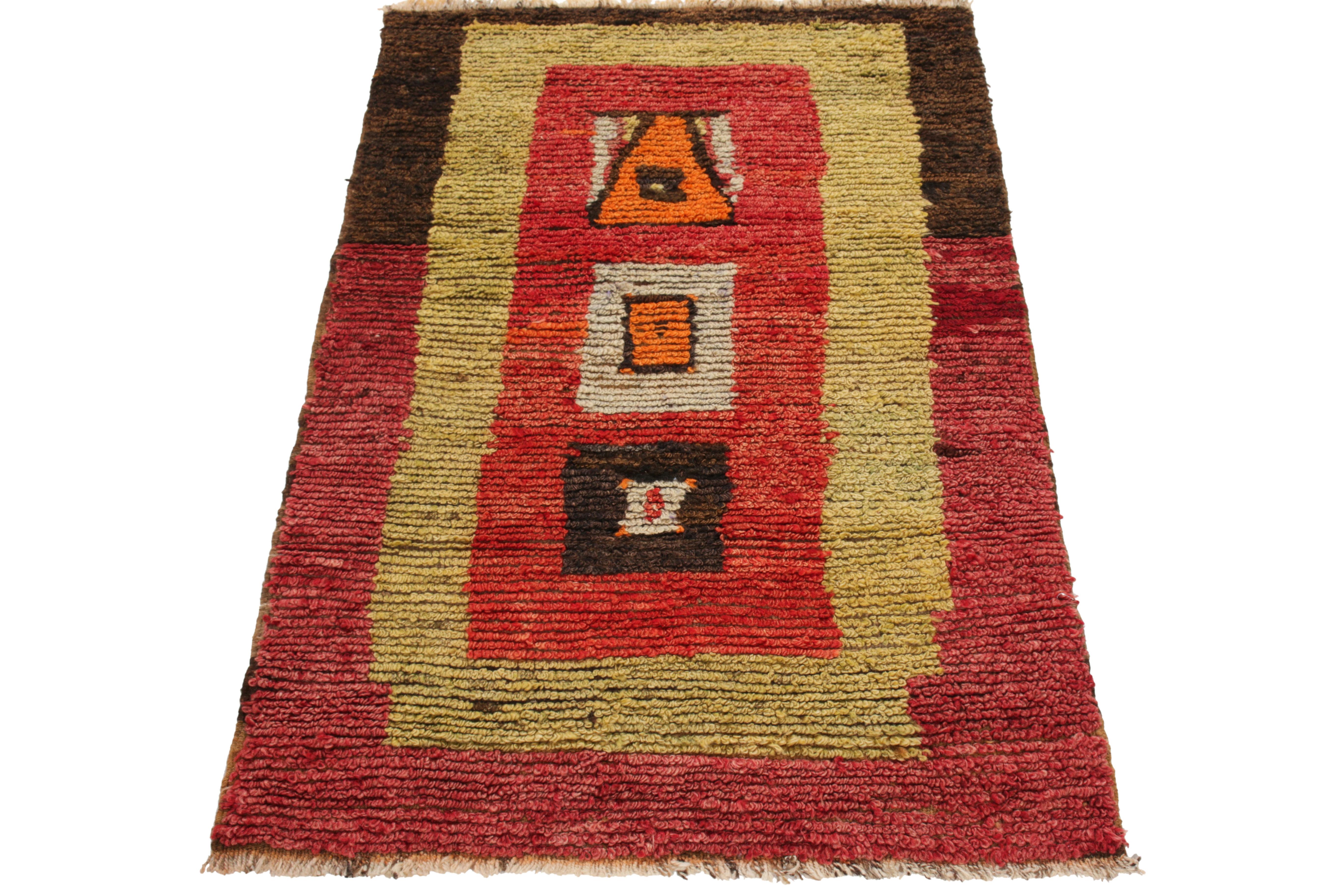 From Rug & Kilim’s Antique & Vintage collection, a 3x5 Turkish Tulu rug casting a clean tribal geometric pattern. Hand-knotted in wool, the 1950s nomadic style drawing enjoys a rustic appeal in tones of scarlet & vermilion red, yellow, brown-black