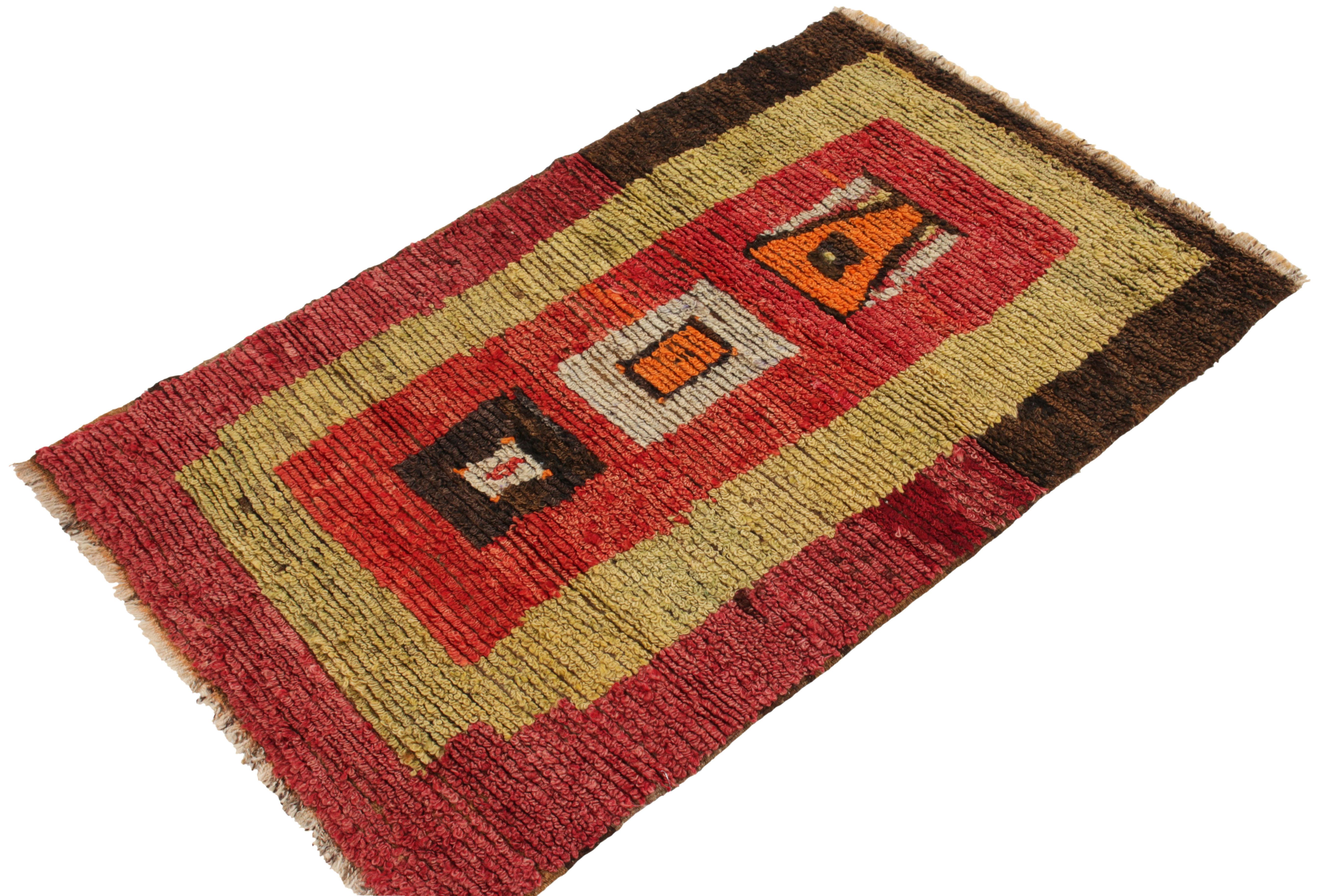 Tribal 1950s Vintage Tulu Rug in Red, Yellow, Brown Geometric Pattern by Rug & Kilim For Sale