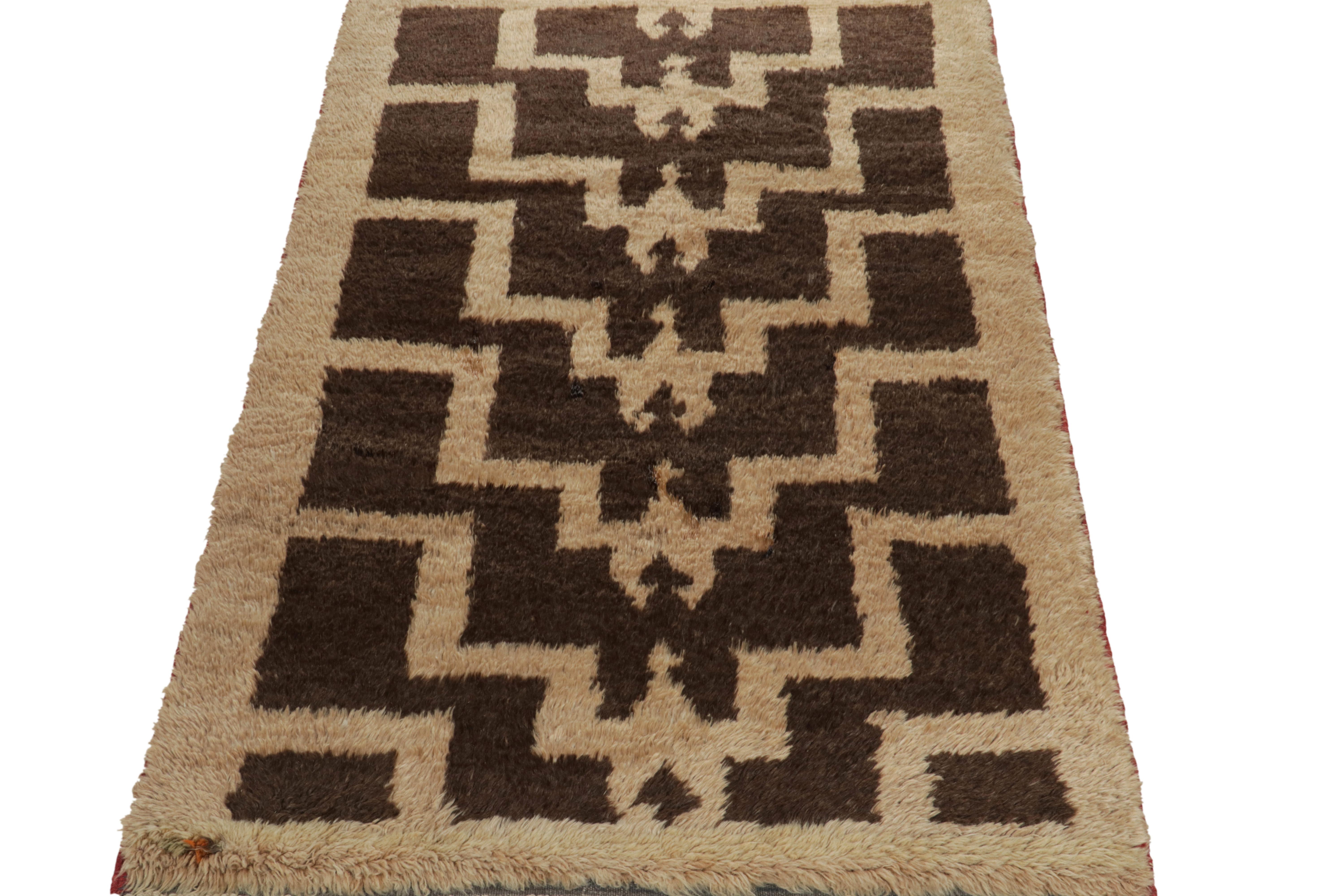 A vintage 3x5 Tulu rug from Turkey entering Rug & Kilim’s most prominent, newly added tribal collection. The piece is hand-knotted in a fine shag pile with high low texturability on the border for enhancing the appeal of the rectilinear geometric