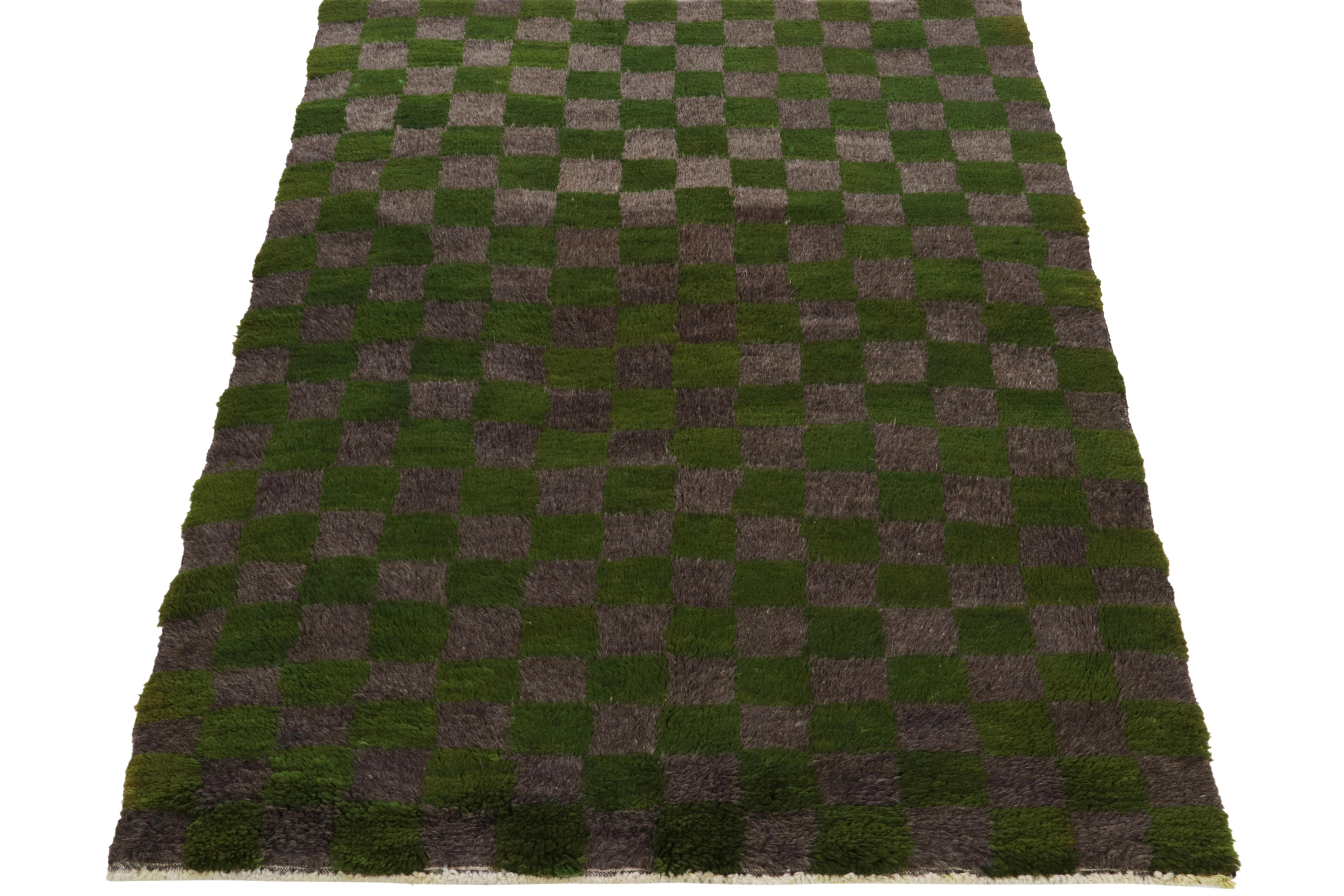 Hand-knotted in wool, a 4X6 vintage Tulu rug originating from Turkey circa 1950-1960, now joining Rug & Kilim’s Antique & Vintage collection. The healthy pile features a well defined checkered pattern in grass green & industrial grey for delicious