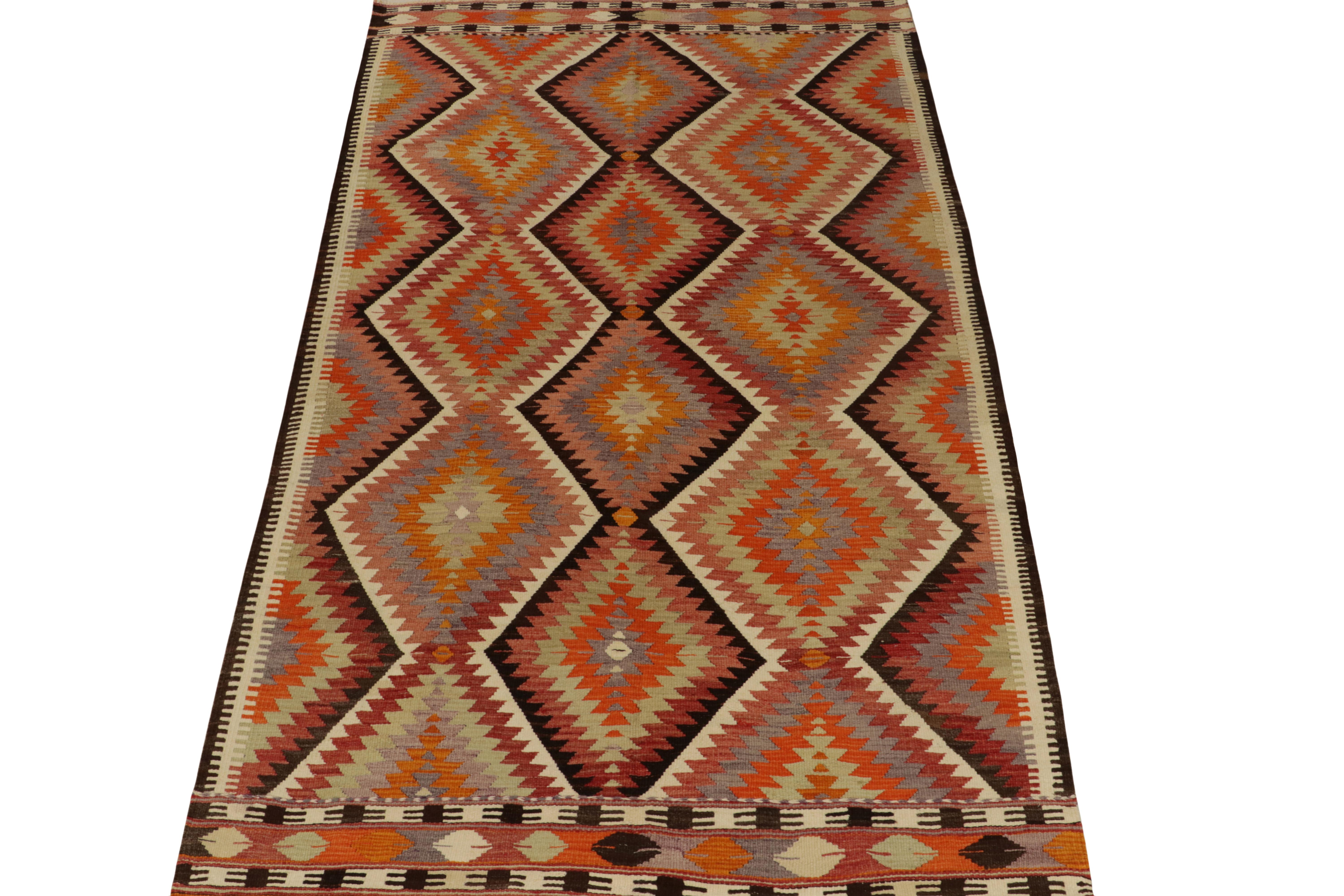 Believed to hail from Antalya circa 1950-1960, a rare Turkish kilim rug exemplifying mid century tribal sensibilities. 

Handwoven in wool, the sharp geometric pattern revels with the most unusual green and orange combination in the colorway